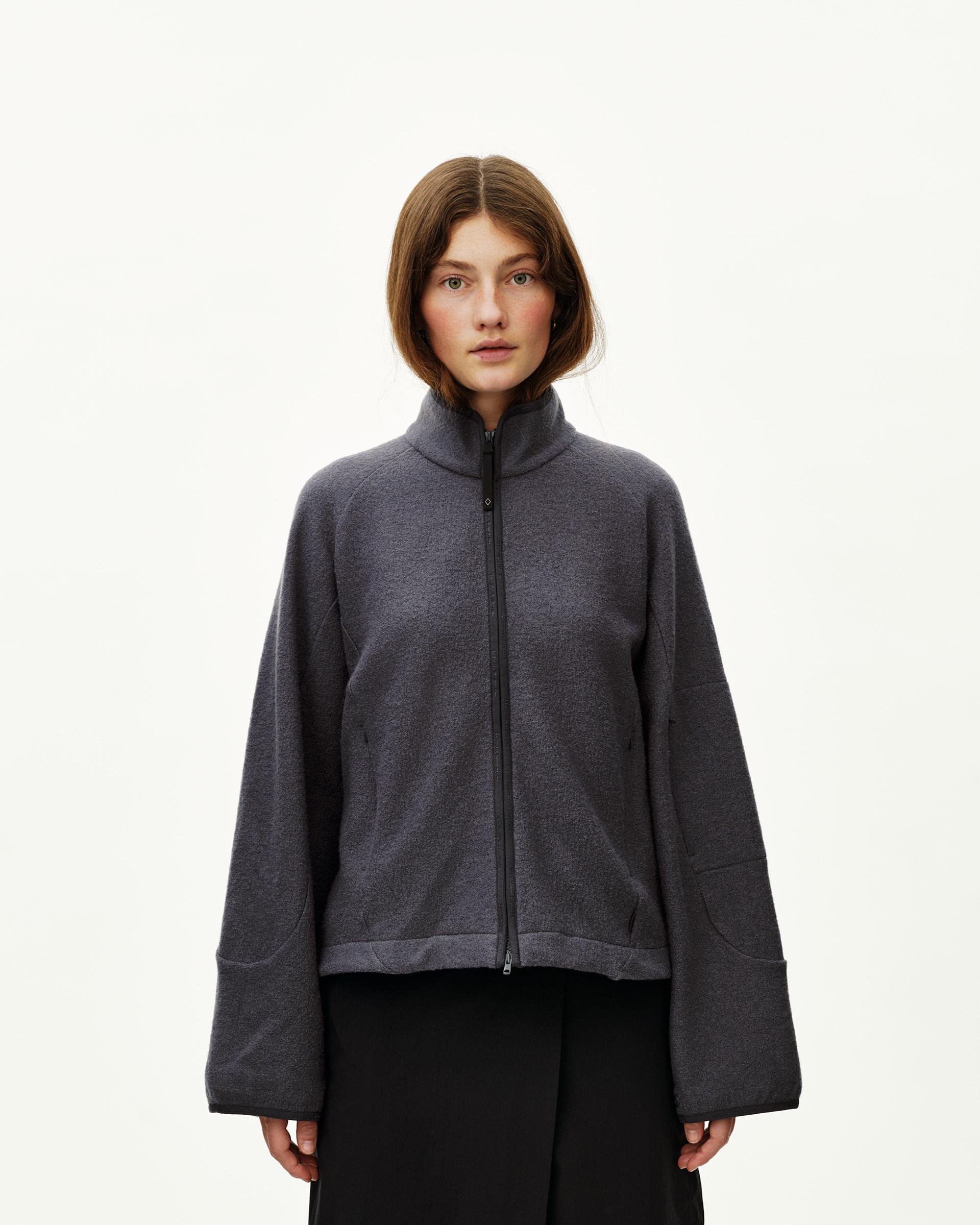Steel grey Off-Race Boiled Wool jacket on model, front view with full zip and mock neck