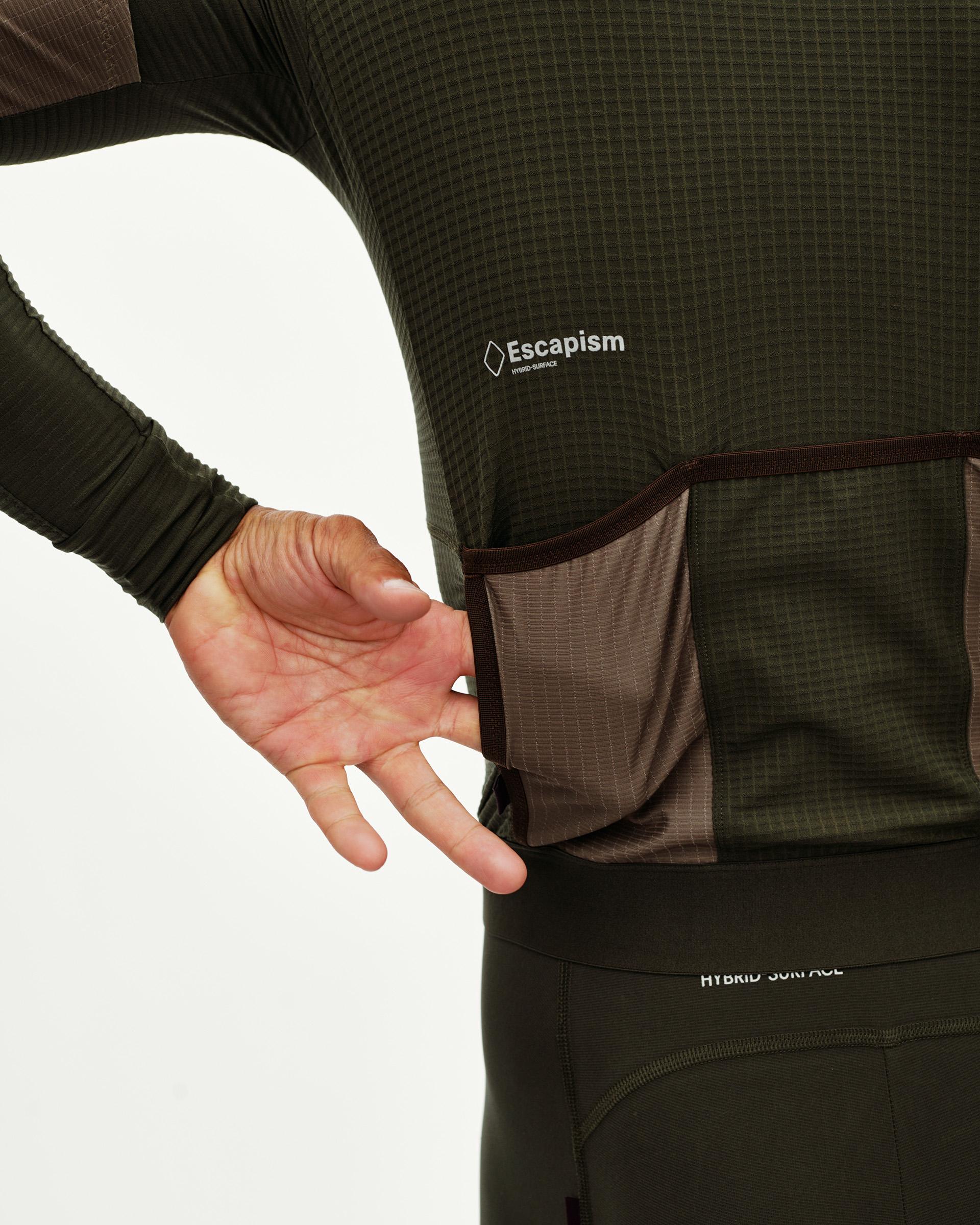 Dark Olive Escapism long sleeve cycling jersey, rear detail on model showing contrast back pocket