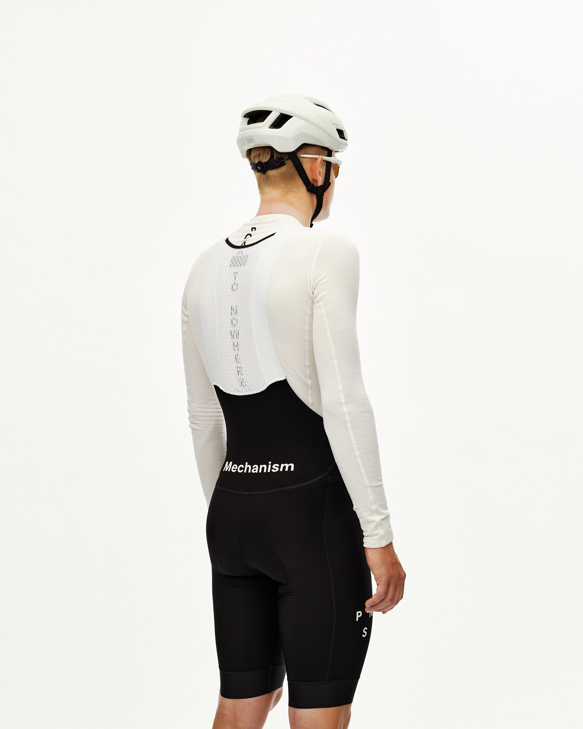 Black Mechanism Thermal cycling bibs on model, rear view with white logo waistband