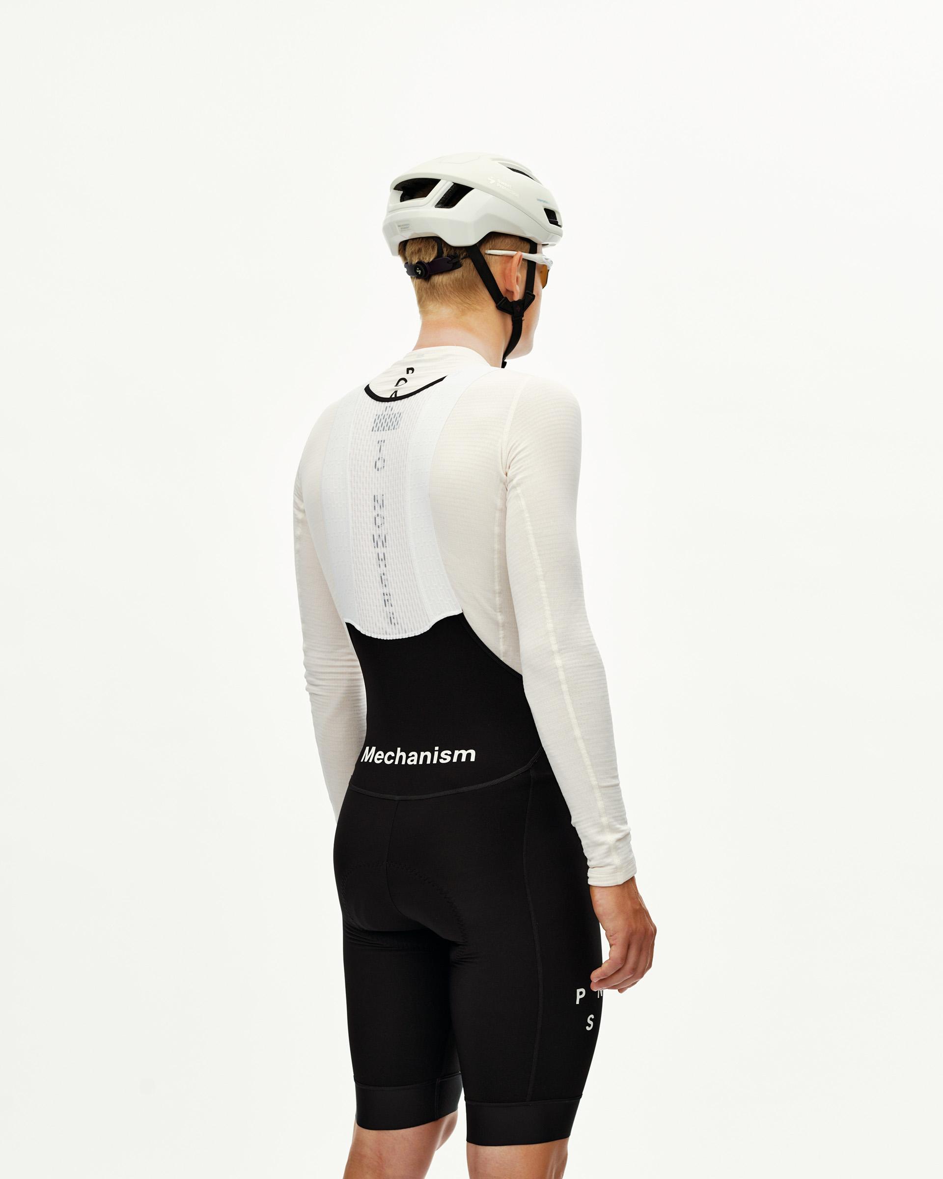 Black Mechanism Thermal cycling bibs on model, rear view with white logo waistband