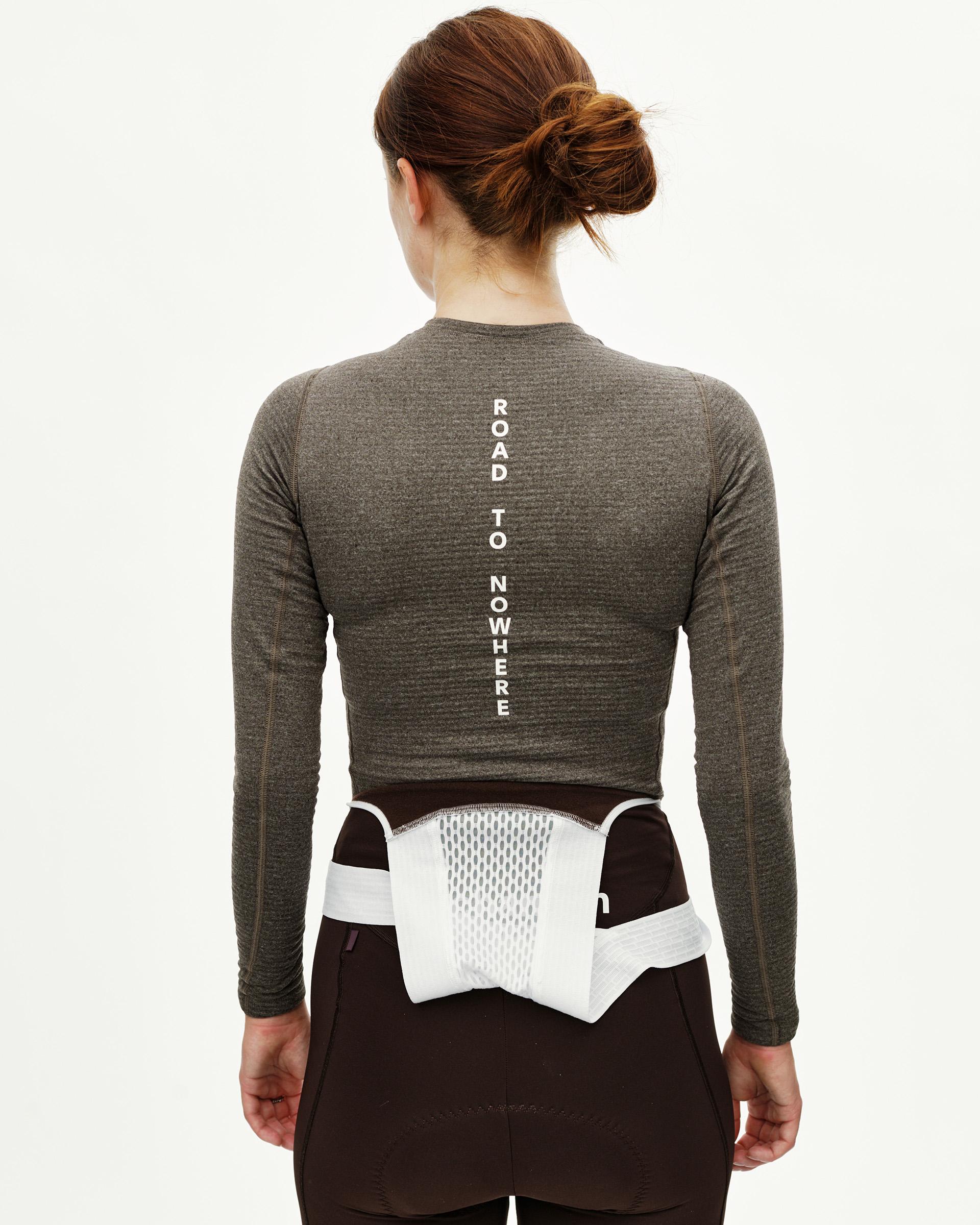 Dark Coffee brown women's thermal long sleeve baselayer, rear view on model with white vertical back print