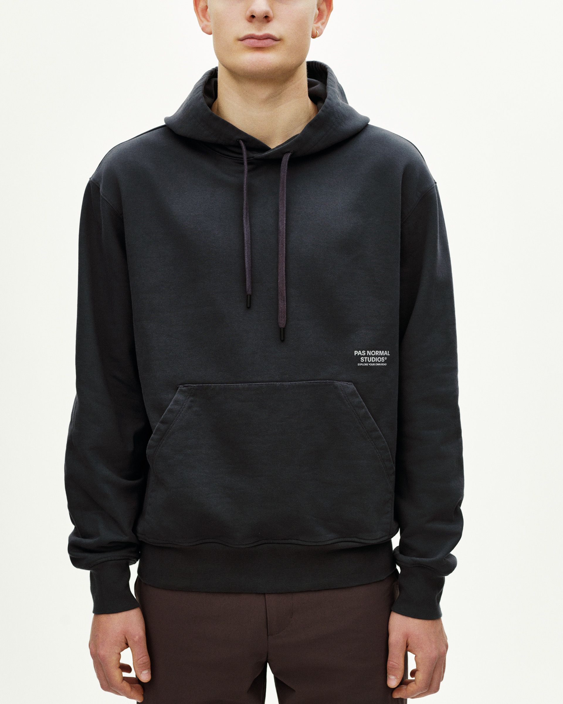 Dark Navy Off-Race Graphic hoodie on model with white chest logo and kangaroo pocket