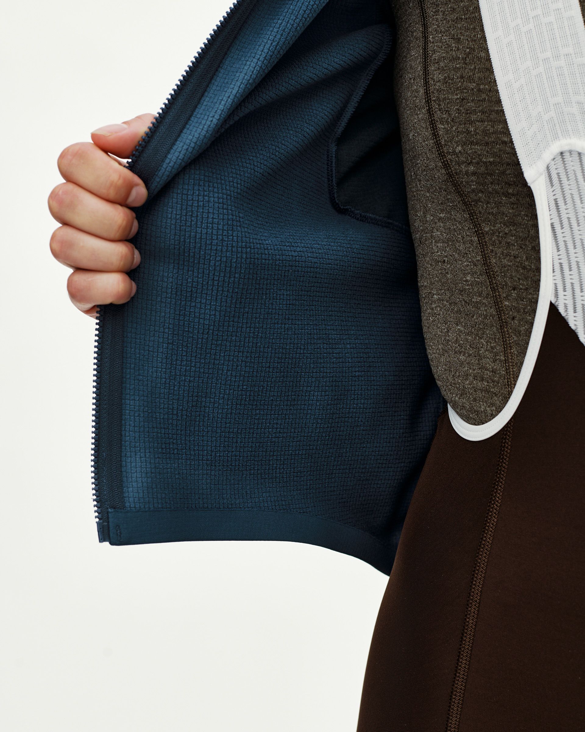 Linen Mechanism Thermal Long Sleeve cycling jersey, interior detail view showing teal grid-fleece lining