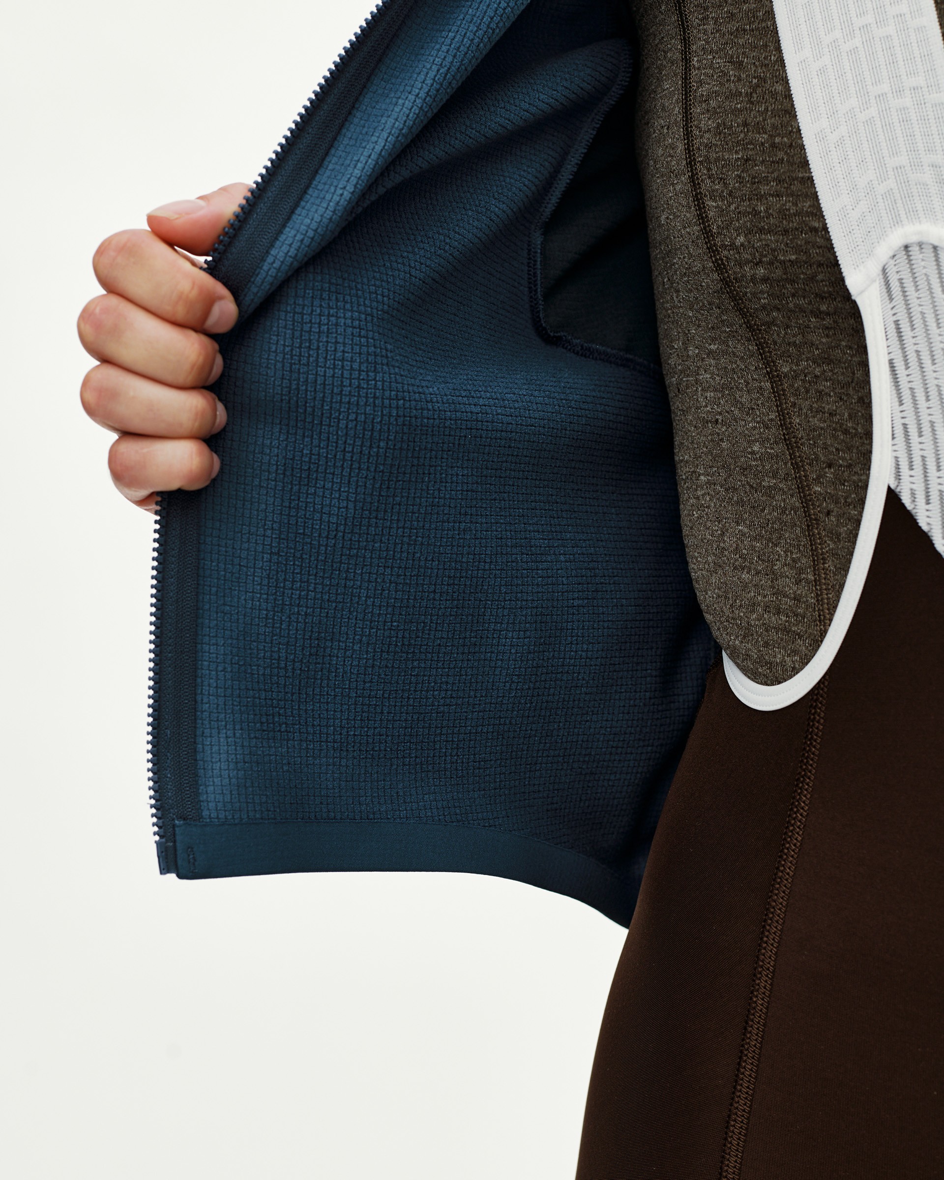 Linen Mechanism Thermal Long Sleeve cycling jersey, interior detail view showing teal grid-fleece lining