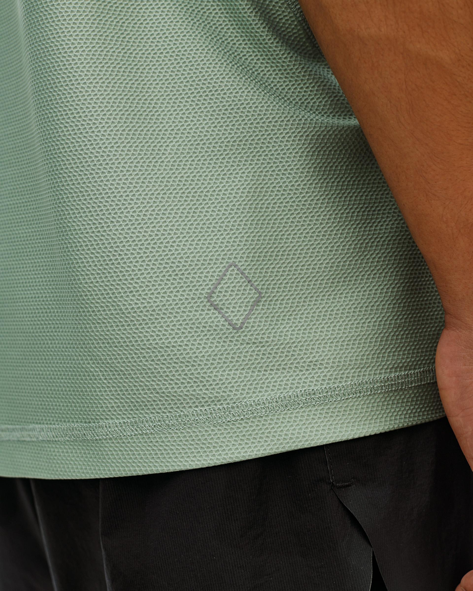 Green Sage Balance T-Shirt, detail view on model showing textured fabric and tonal diamond logo