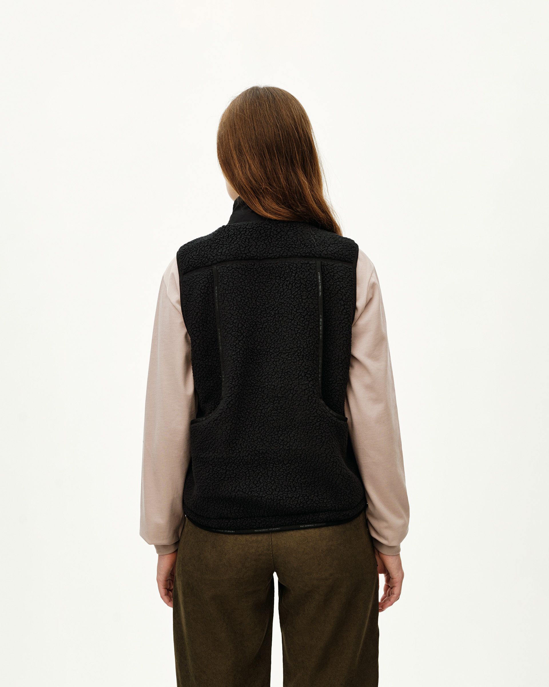 Black Off-Race Pile Fleece Vest on model, rear view with sherpa texture and seam detailing