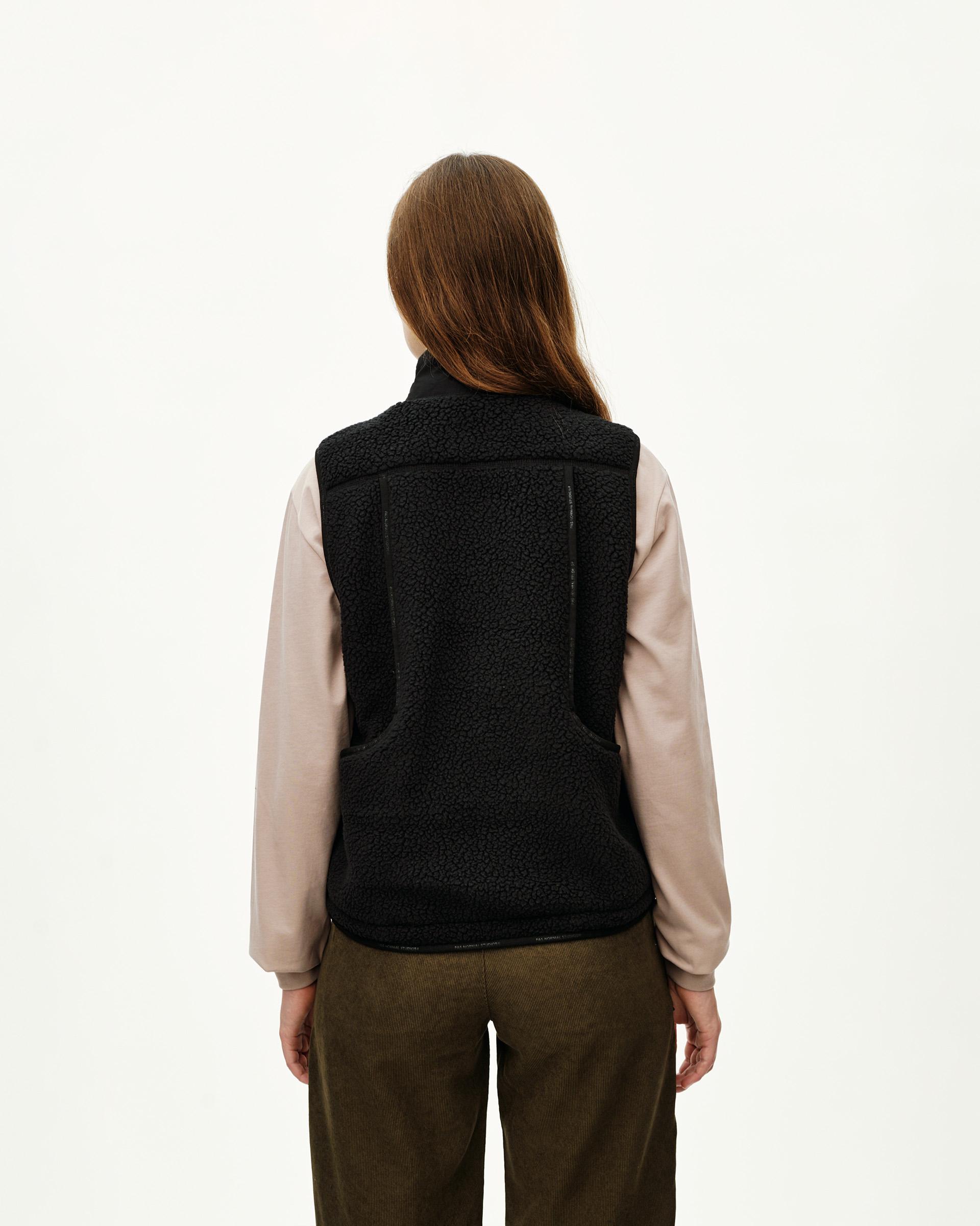 Black Off-Race Pile Fleece Vest on model, rear view with sherpa texture and seam detailing