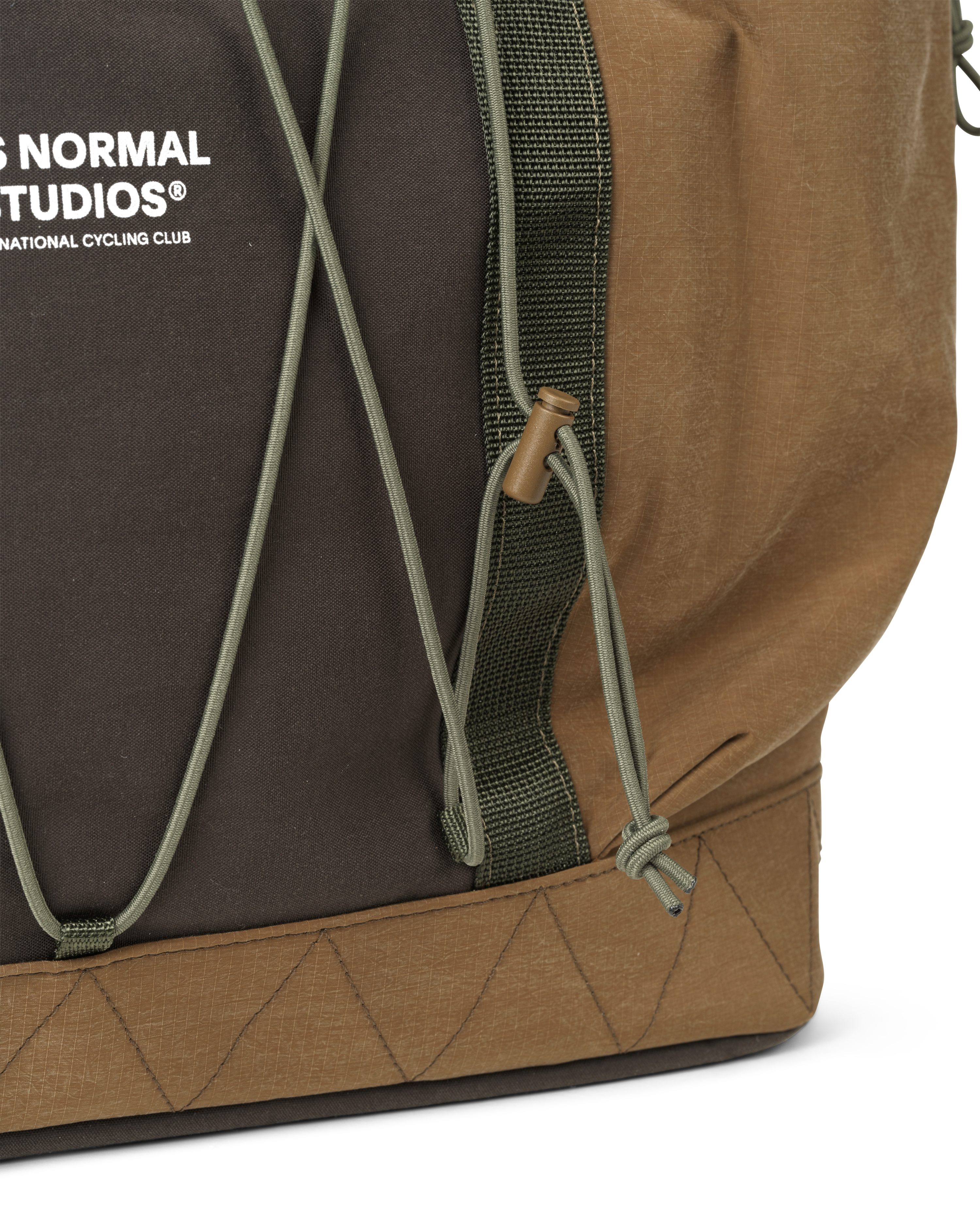 Light Brown Porter-Yoshida tote bag, side detail view with olive green strap and cord toggle closure