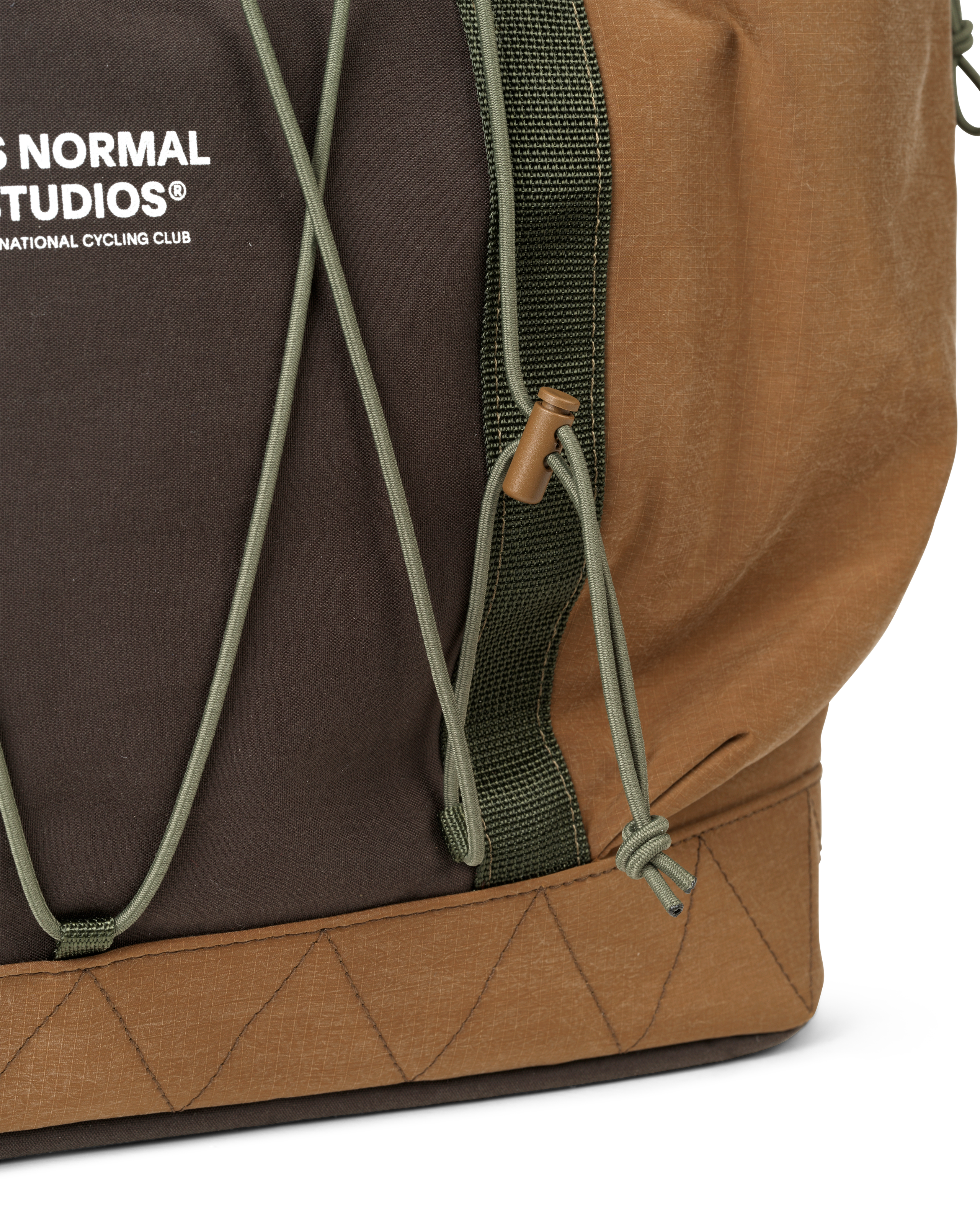 Light Brown Porter-Yoshida tote bag, side detail view with olive green strap and cord toggle closure