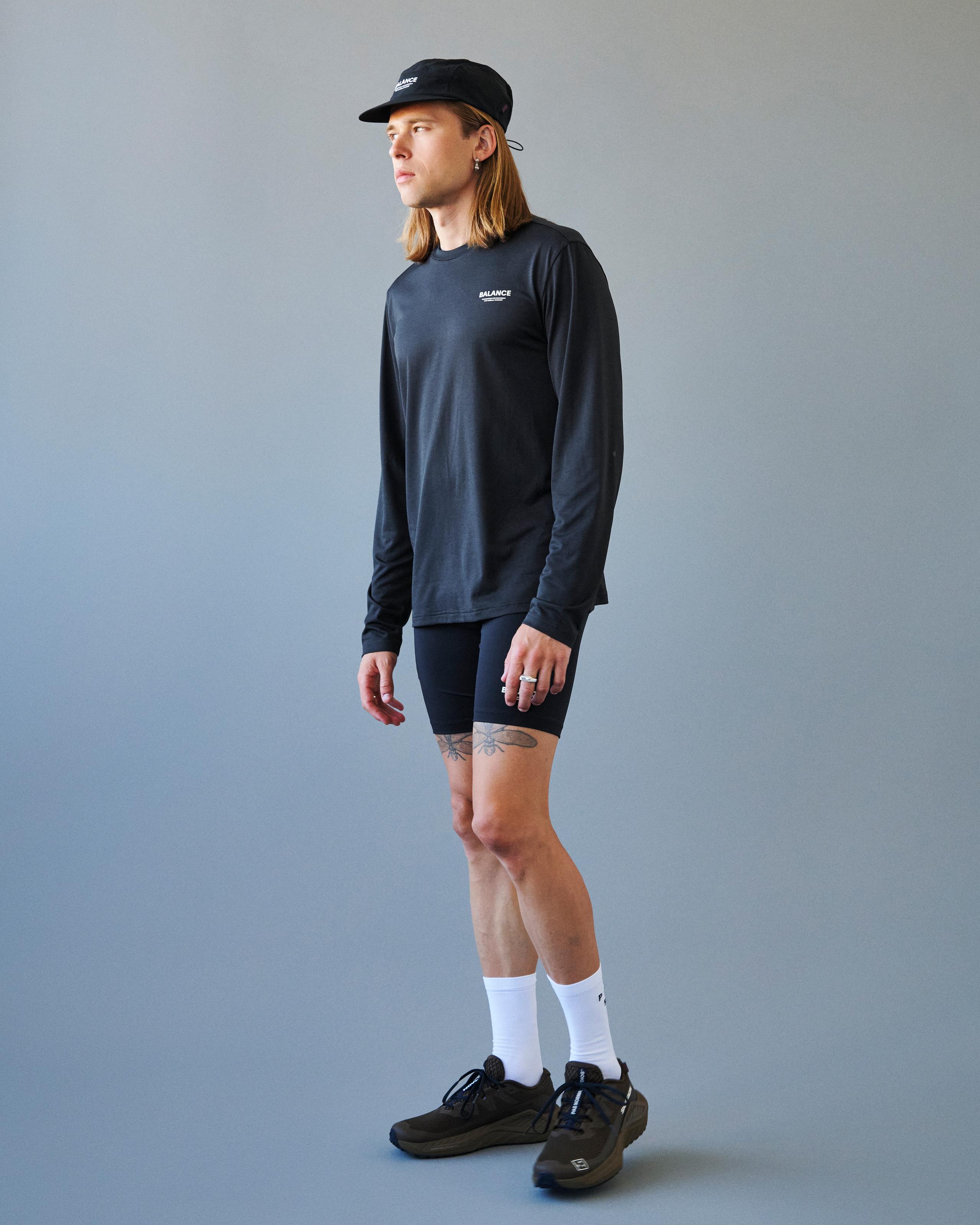 Black Balance long sleeve t-shirt on model with white chest print