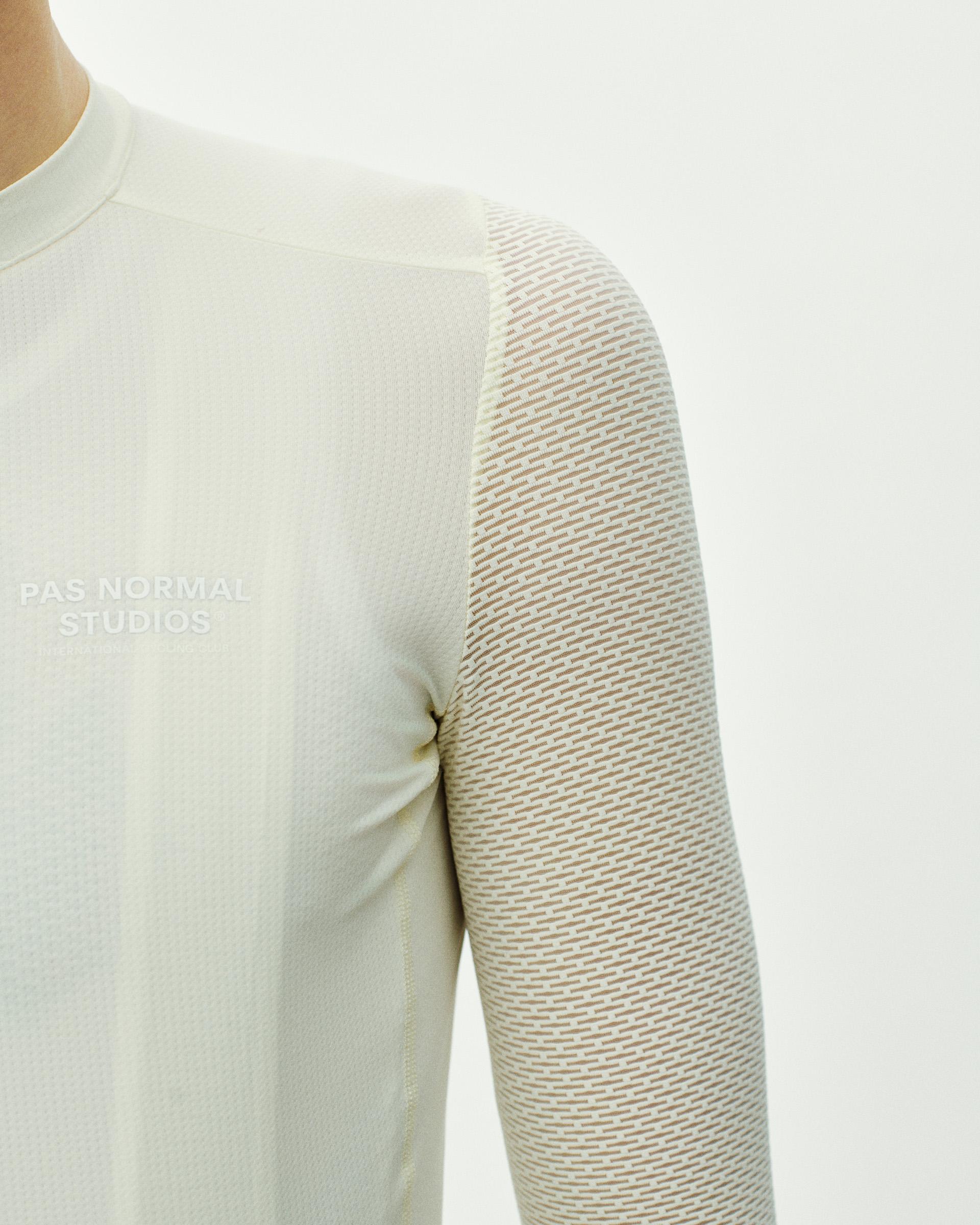 Off White Essential long sleeve cycling jersey, front detail on model with mesh patterned sleeve panel