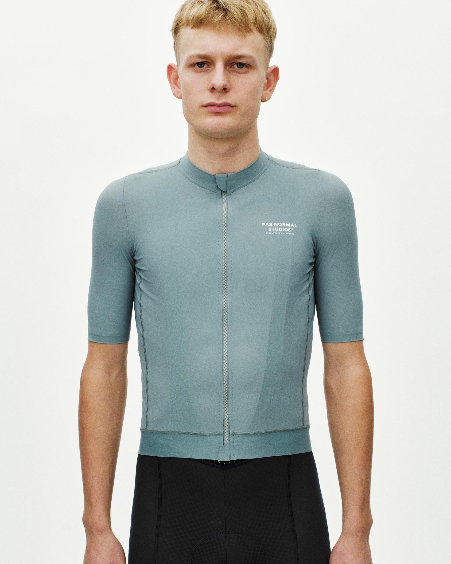 Calcite Blue Essential cycling jersey on model front view with full zip