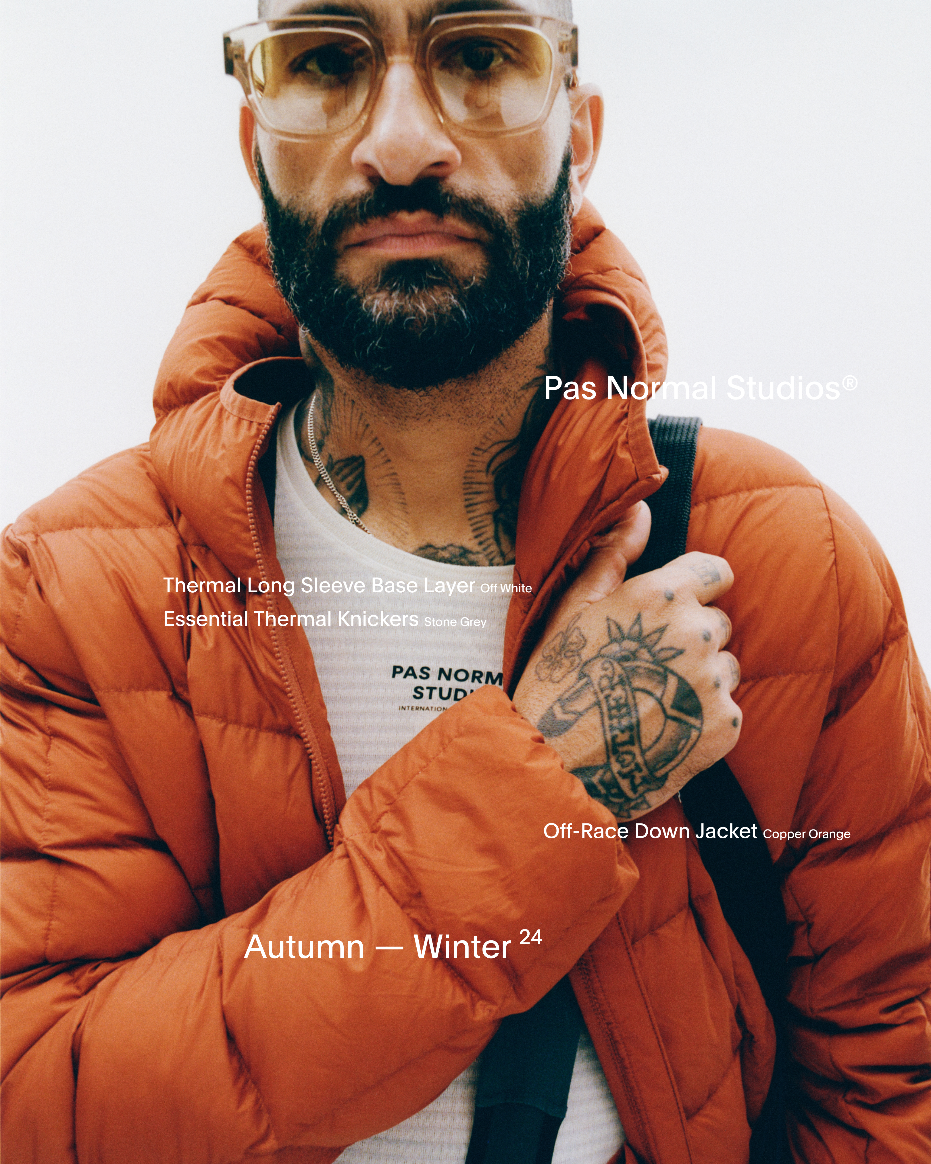 Model wearing Off-Race Down Jacket in orange with Essential Thermal Knickers and Thermal Long Sleeve Base Layer