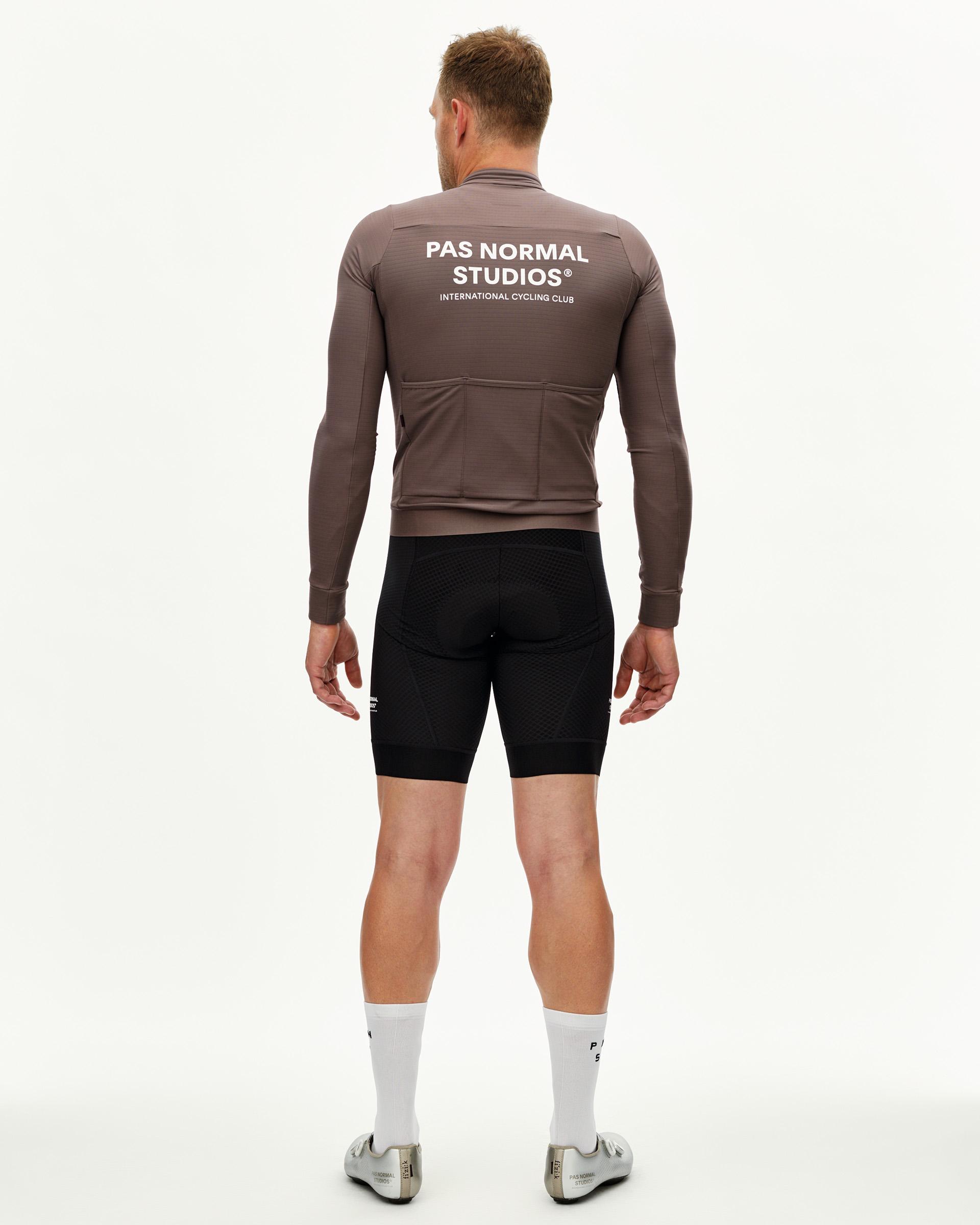 Dusty Plum Essential long sleeve cycling jersey on model, rear view with white back print