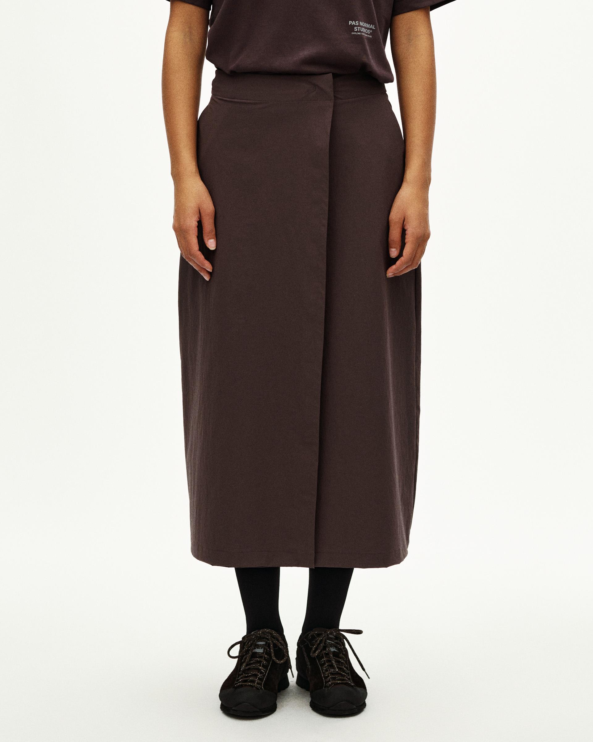 Dark Purple Off-Race Tech skirt on model, front view with midi length and elastic waistband