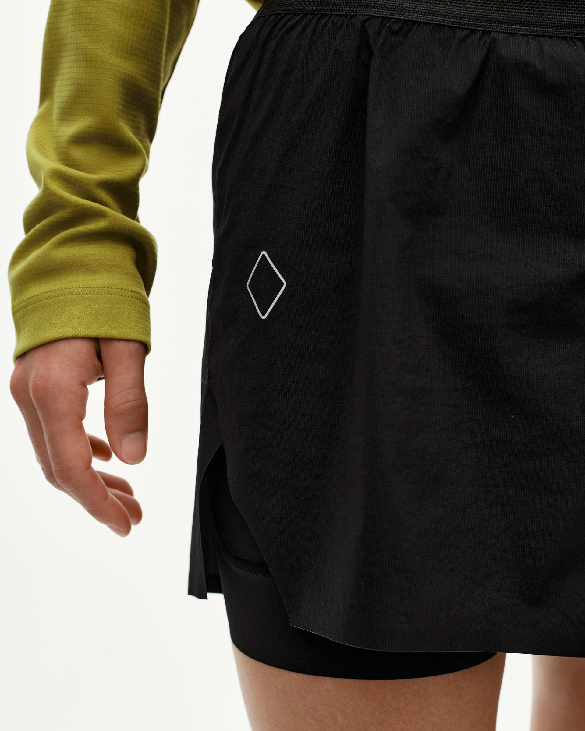 Black Balance 2-in-1 shorts, side detail on model with diamond logo print
