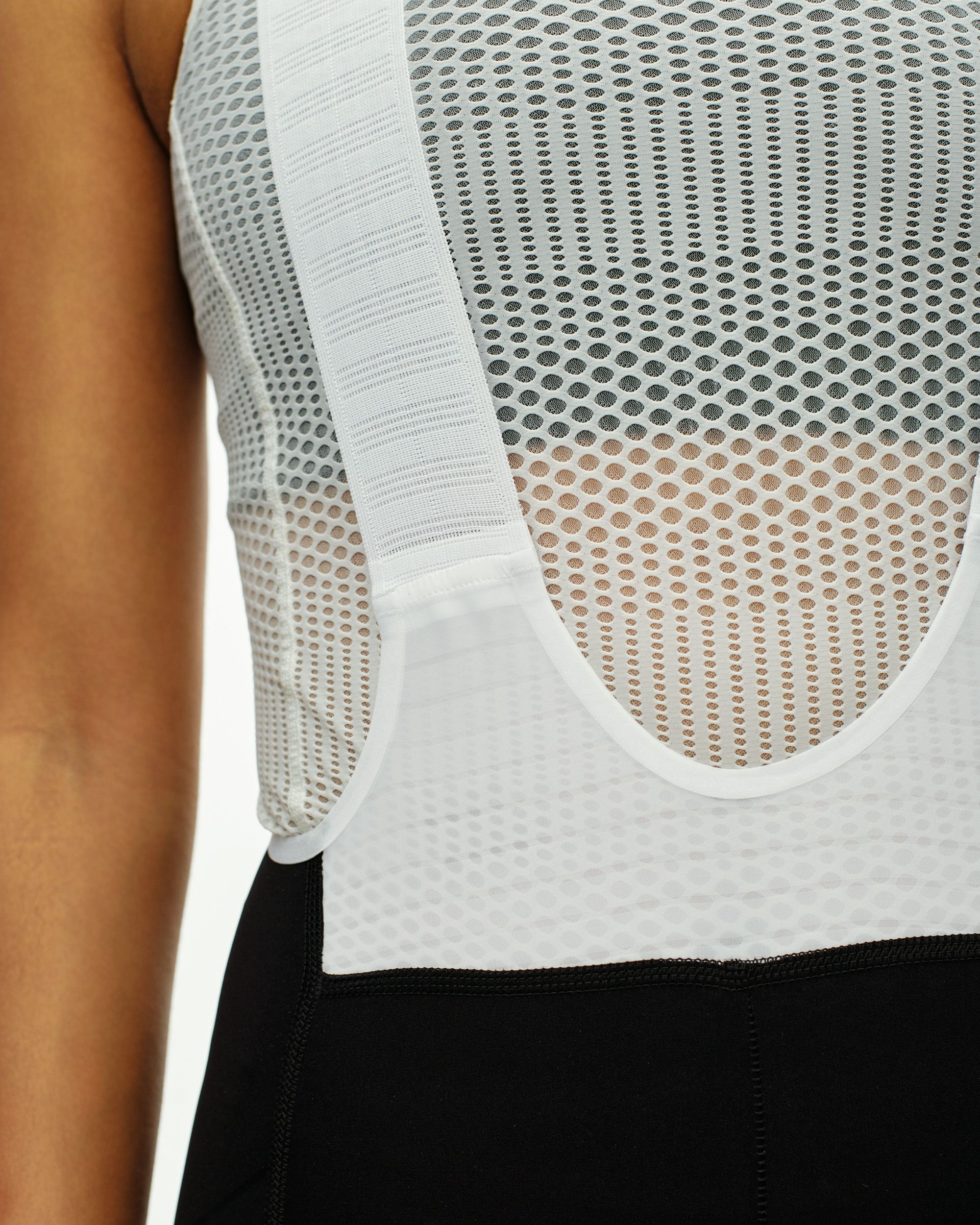 Black PAS Mechanism Pro bibs on model, side view with white mesh bib panel