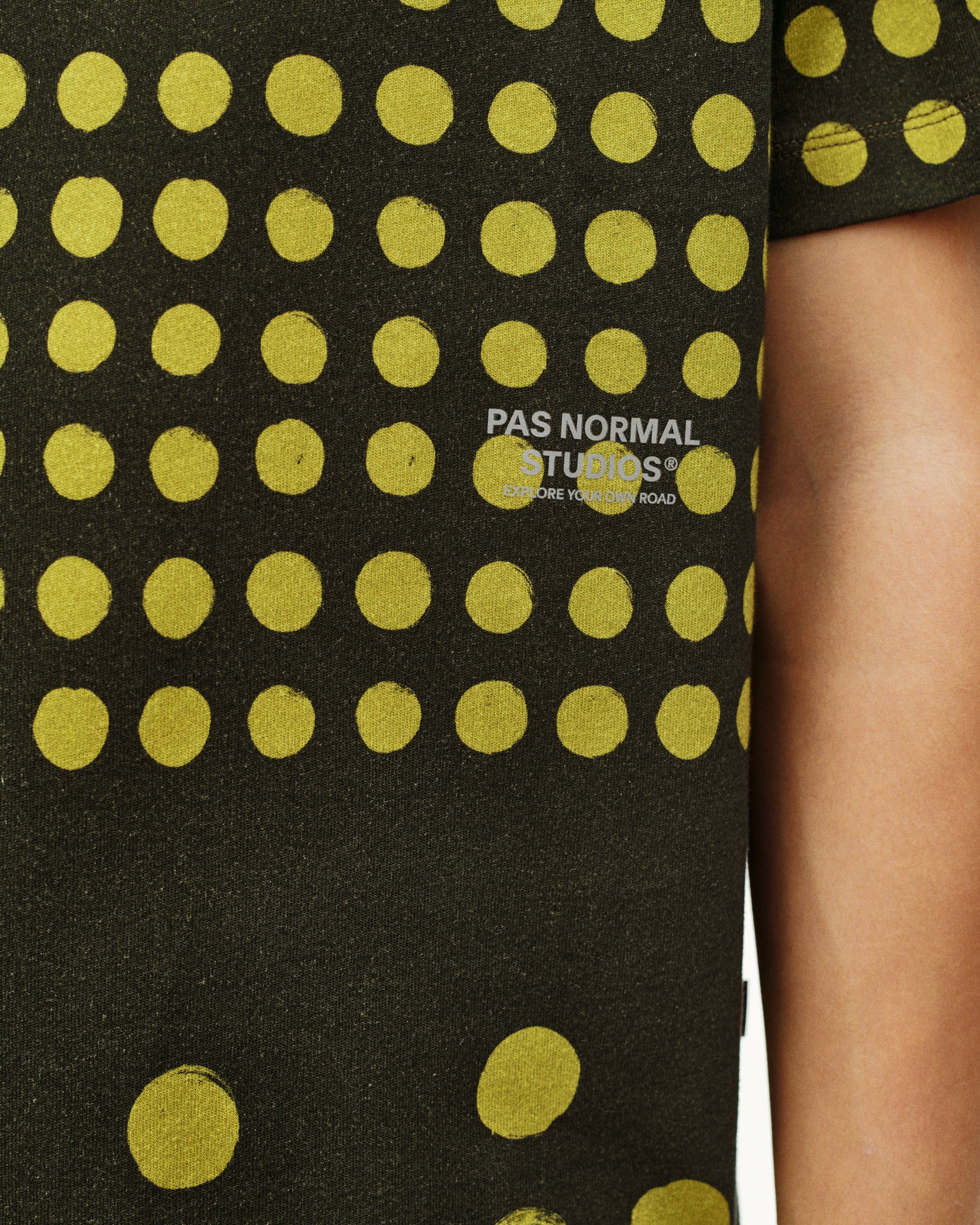 Brown Off-Race Graphic T-shirt on model with yellow polka dot print