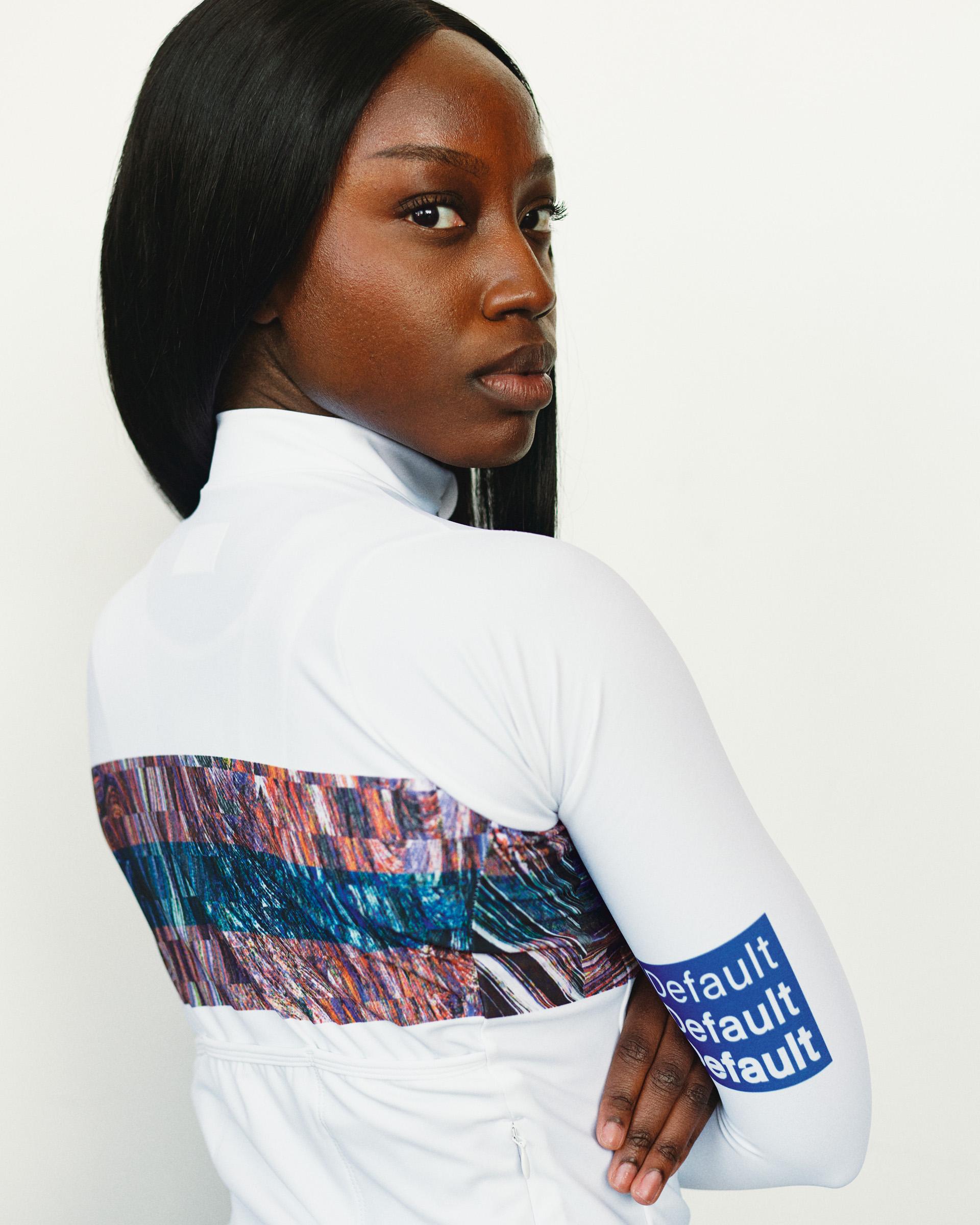 Human Error White T.K.O. Mechanism women's long sleeve cycling jersey on model, rear view with abstract print panel