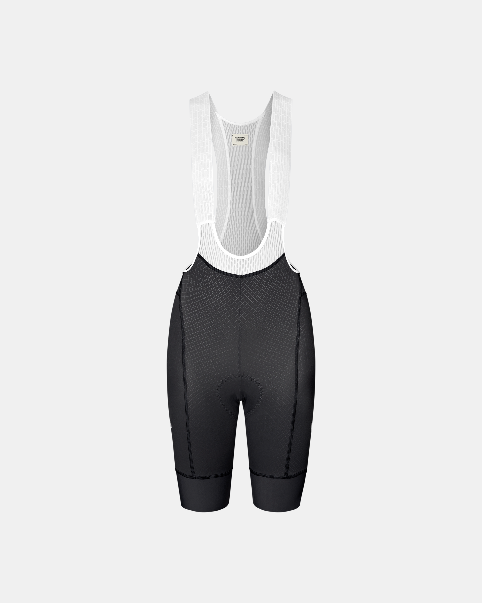 Dark Navy Mechanism women's cycling bibs, front flat lay with white mesh bib straps and textured front panel