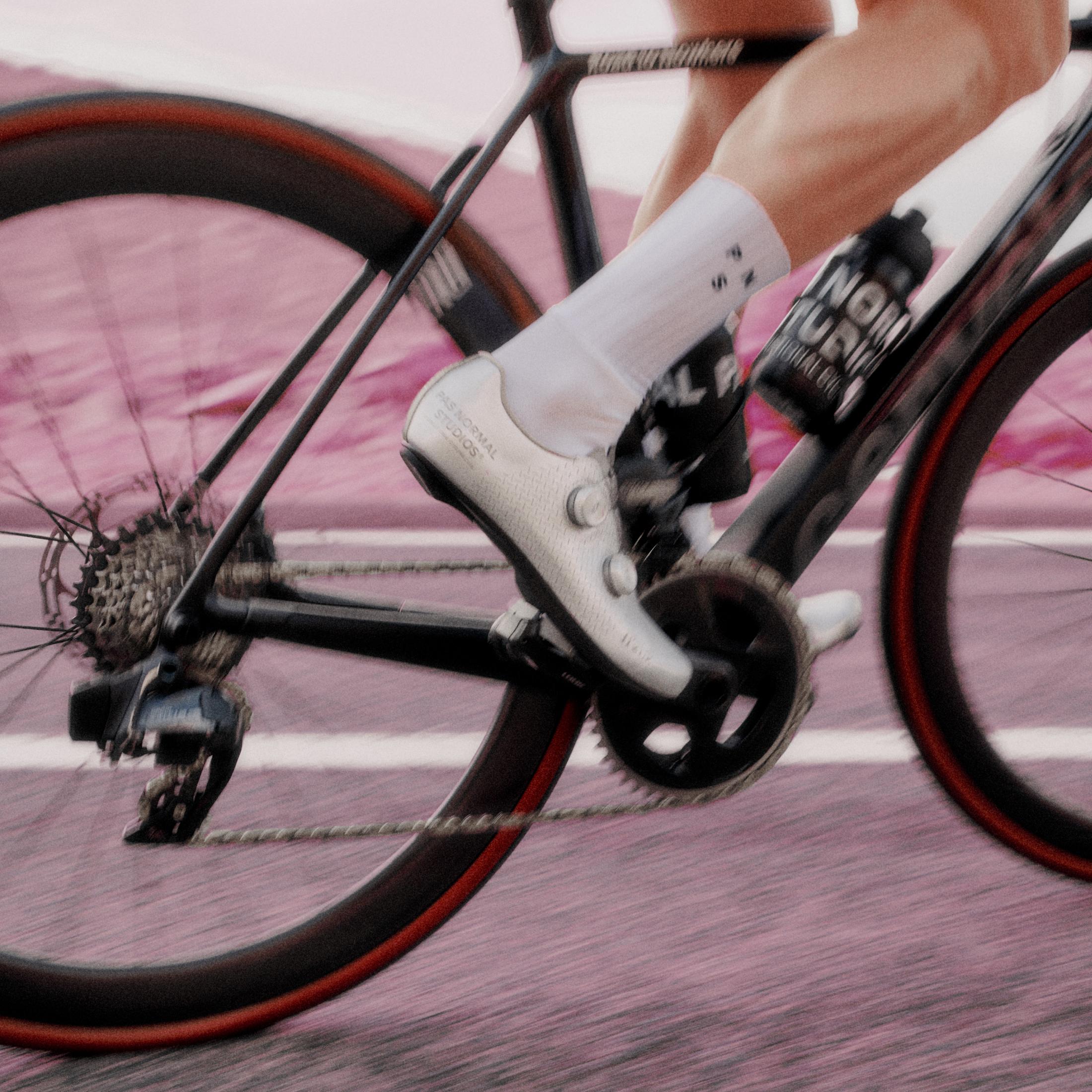Cyclist wearing white cycling shoes with black pedals on pink salt flats