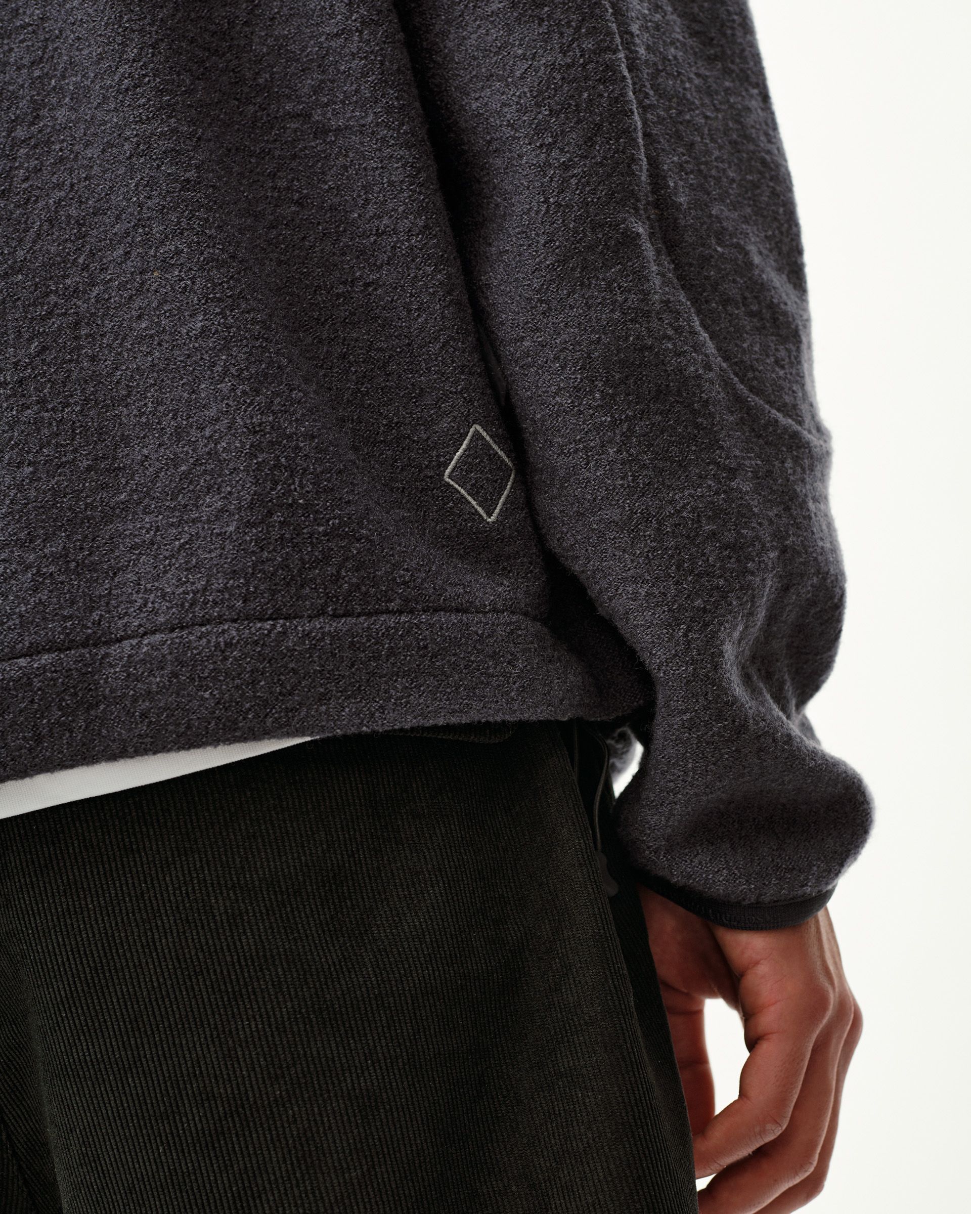 Steel grey Off-Race Boiled Wool Half-Zip outerwear, side detail on model with diamond logo embroidery