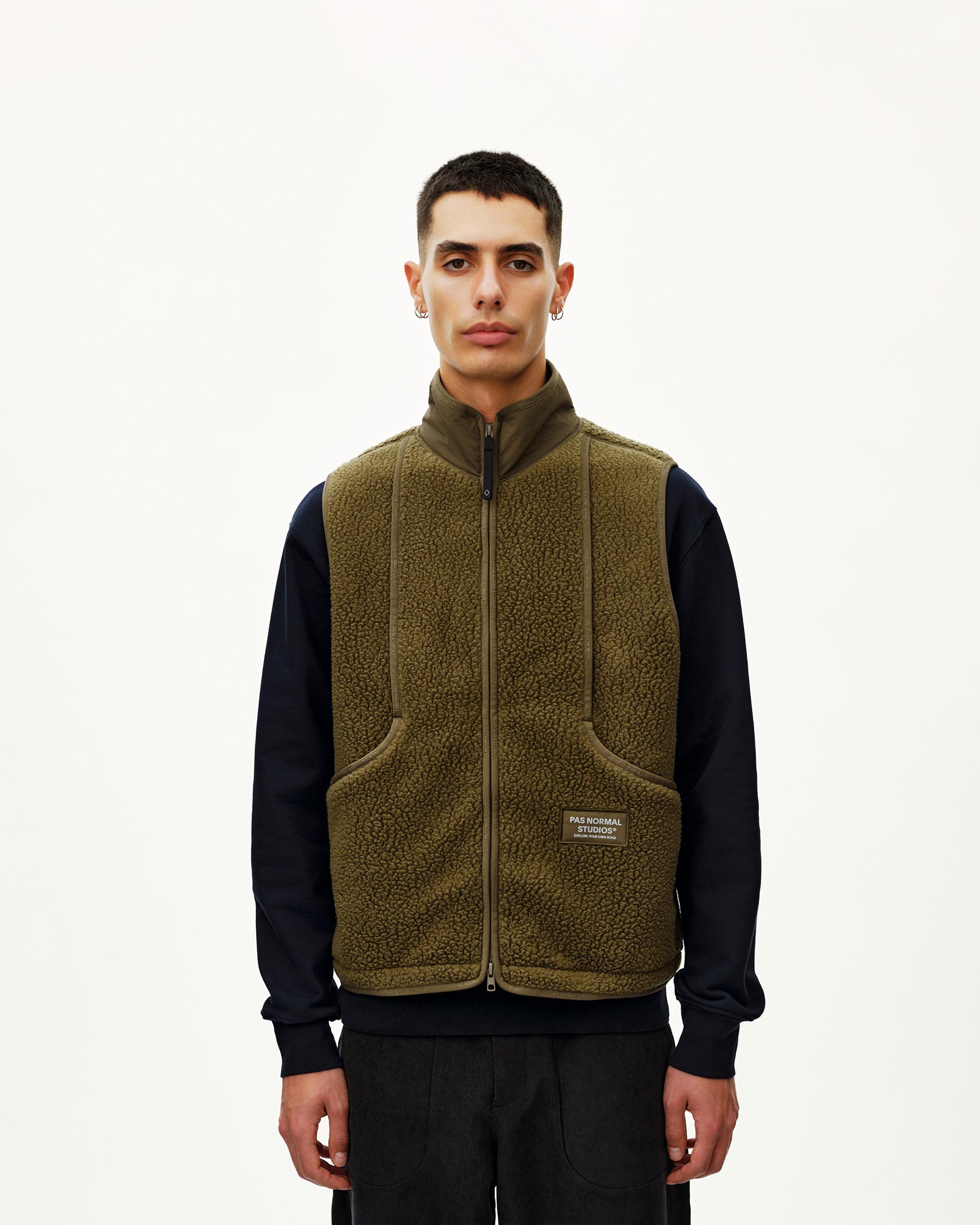 Deep Olive Off-Race Pile Fleece vest on model, front view with full zip and two lower pockets
