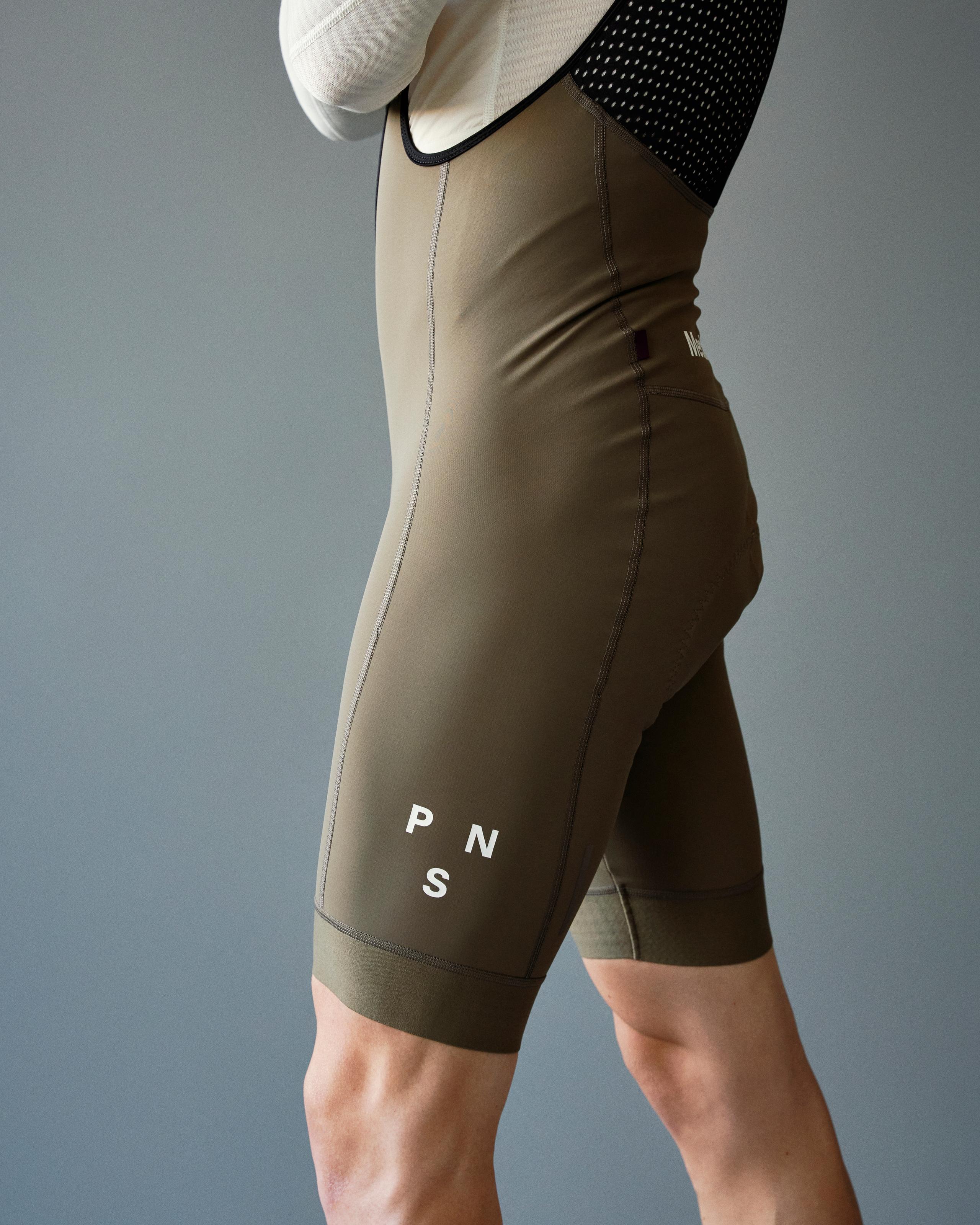 Dark Stone Mechanism Deep Winter bibs, side view on model with white leg branding