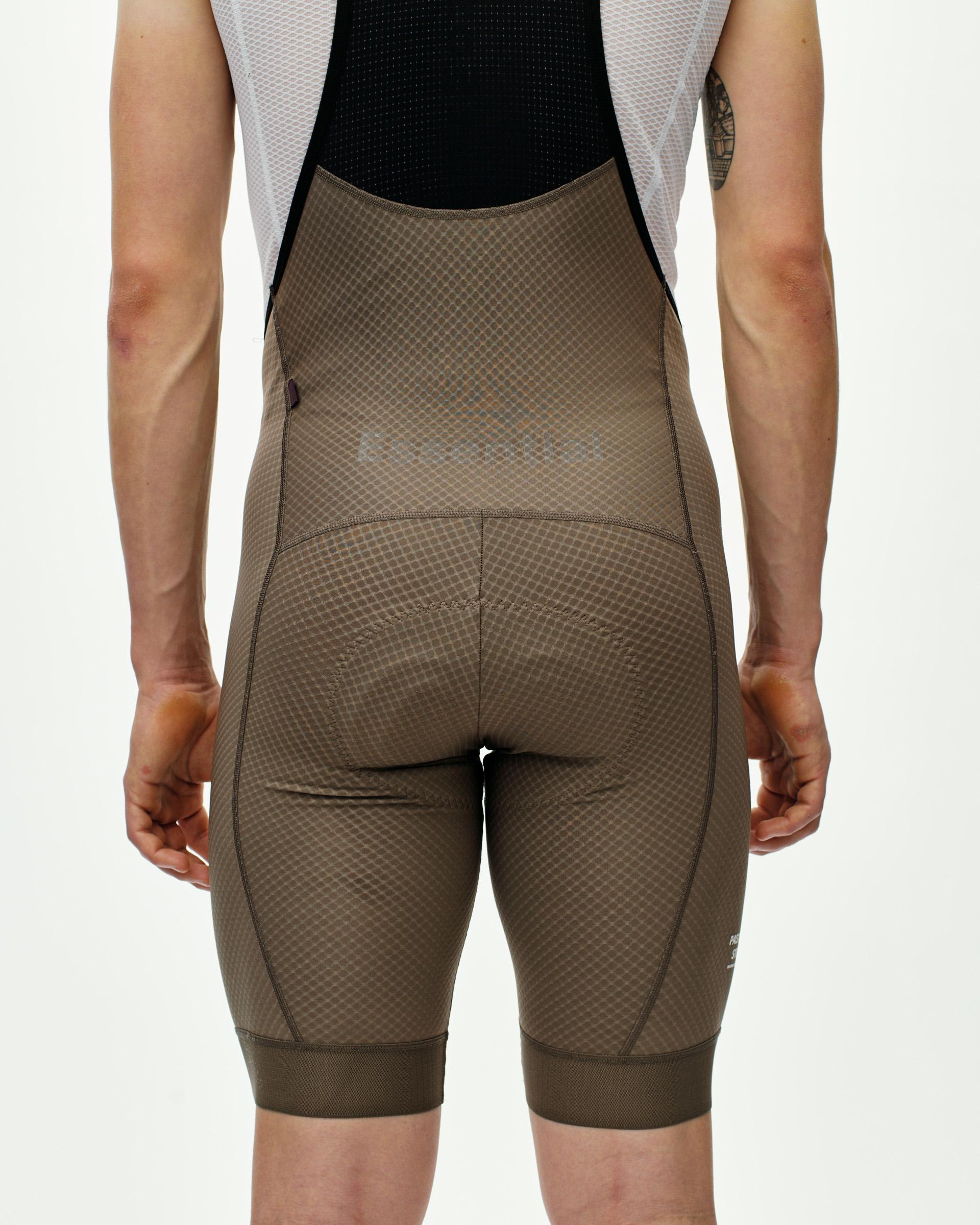 Earth Essential cycling bibs on model, rear view with diamond textured fabric