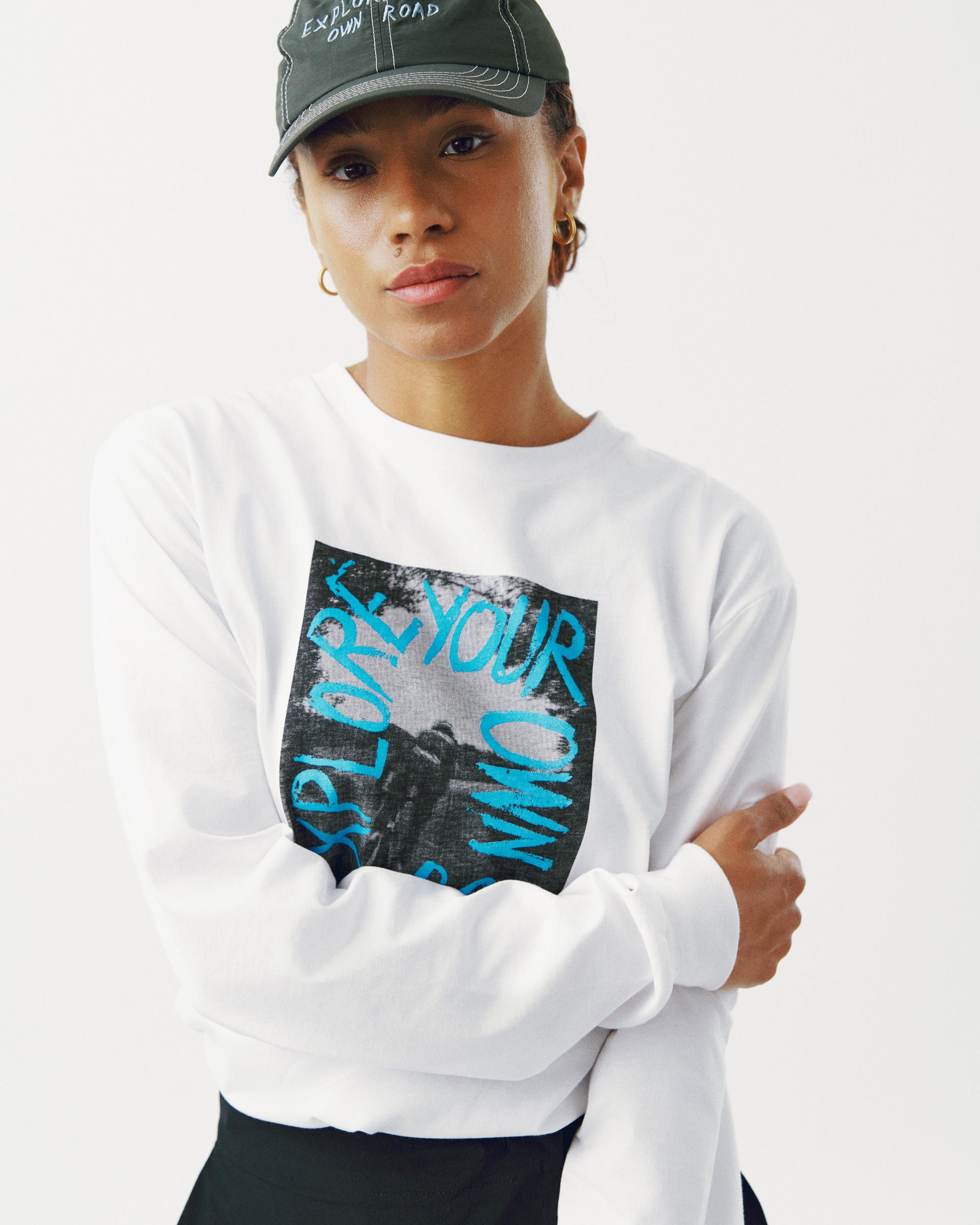White Off-Race Graphic long sleeve t-shirt on model with blue chest graphic print