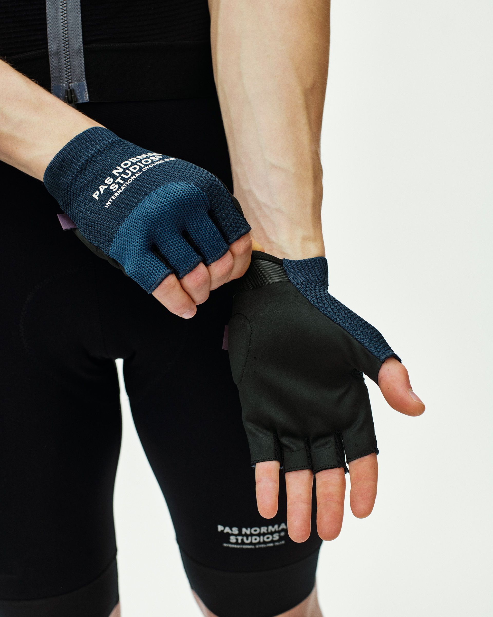 Navy Escapism cycling mitts on model showing fingerless design with textured grip palm