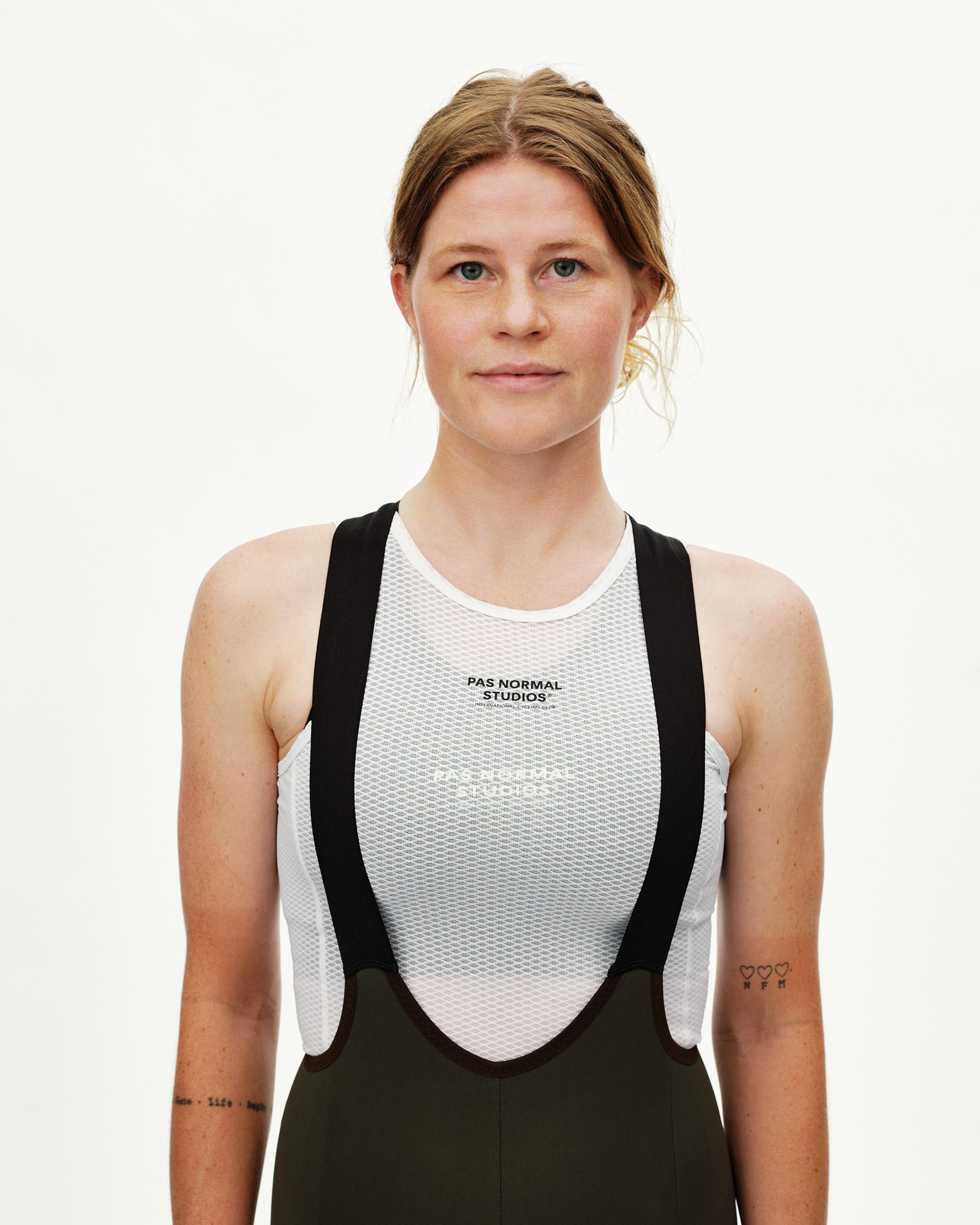 Dark Olive Escapism Cargo cycling bibs on model, front view with white mesh base layer