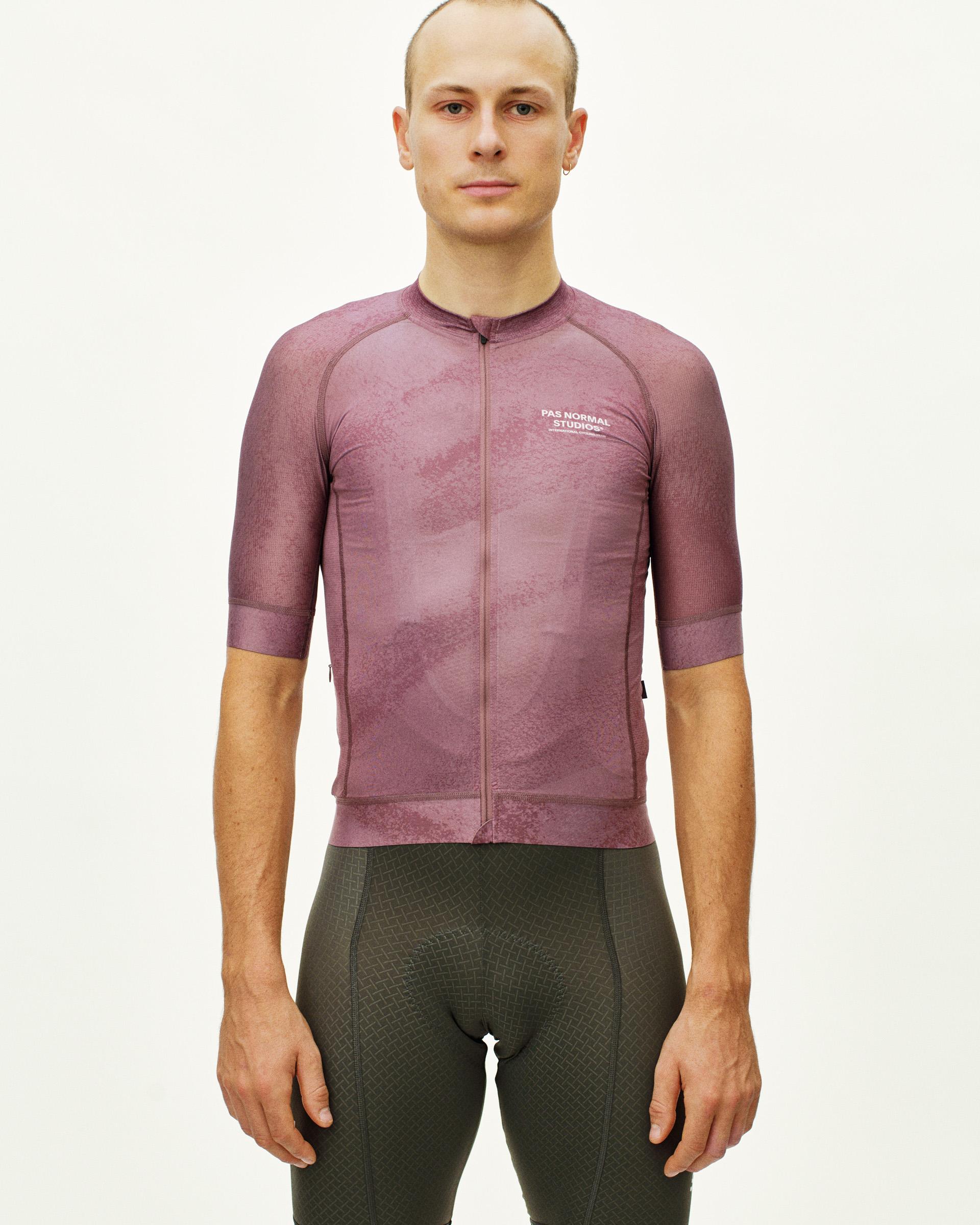 Purple Mechanism cycling jersey on model, front view with white chest logo