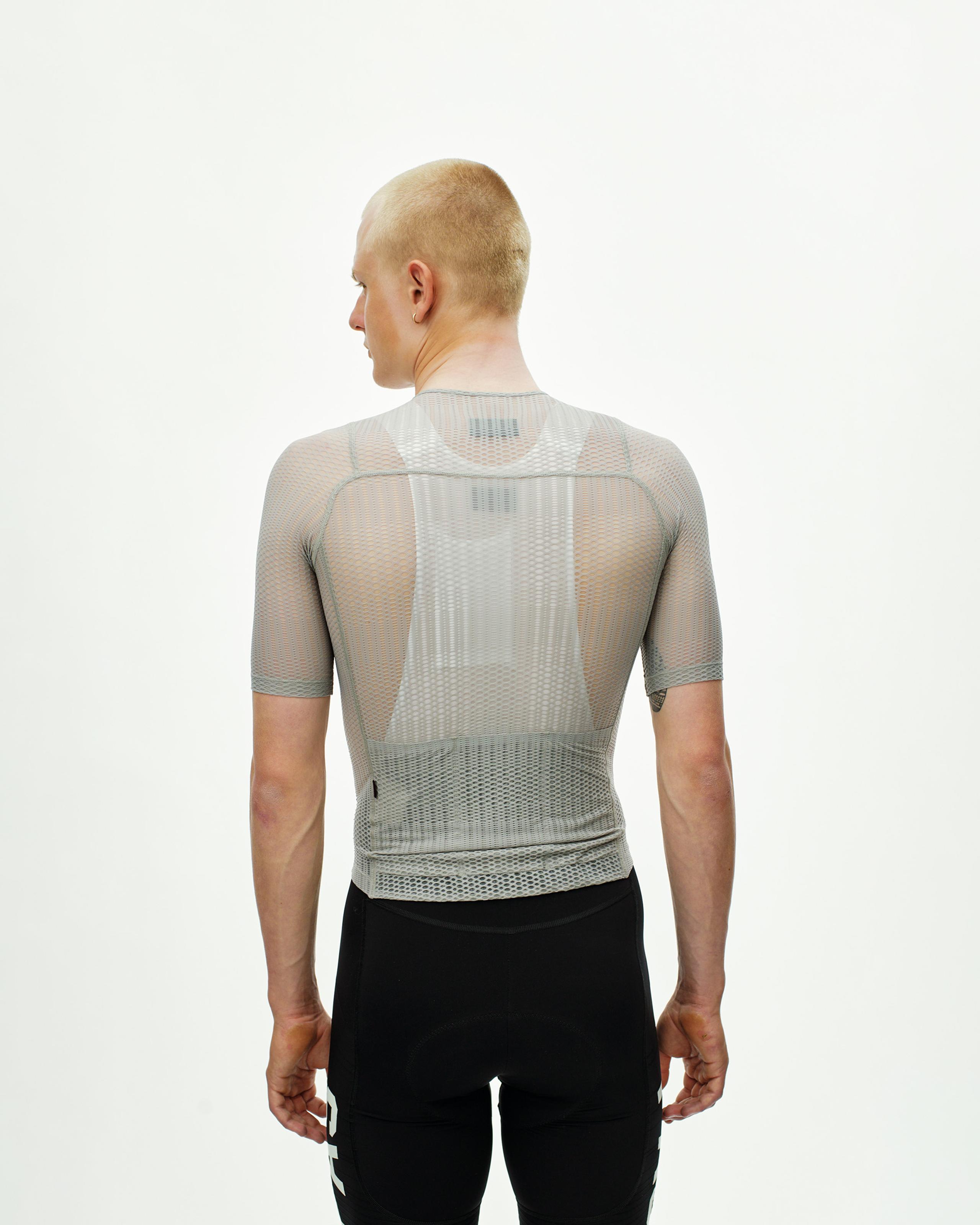 Grey PAS Mechanism Pro Zipless cycling jersey, rear view on model with mesh panel construction
