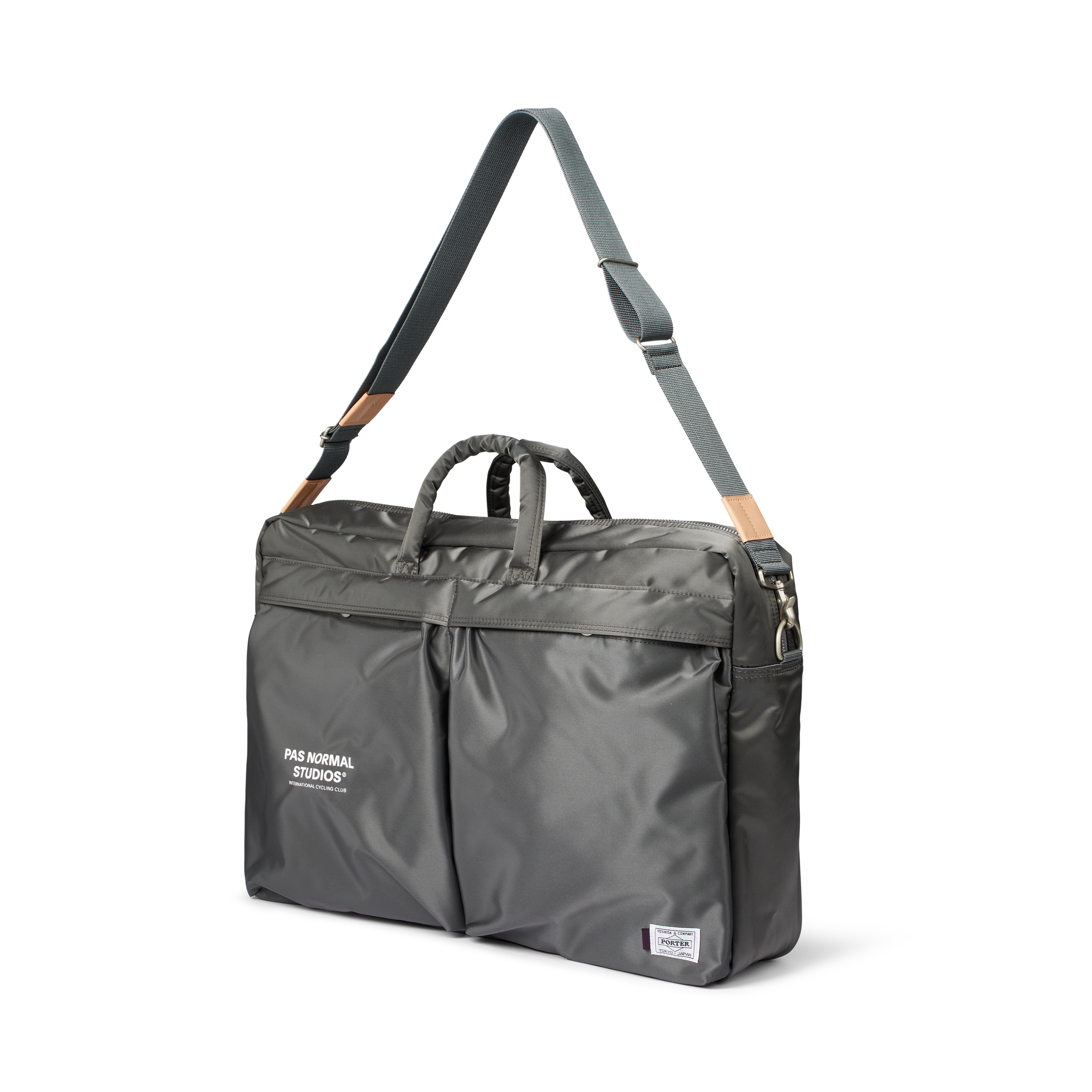 Grey Porter-Yoshida 2-Way briefcase, three-quarter view with shoulder strap and leather trim accents