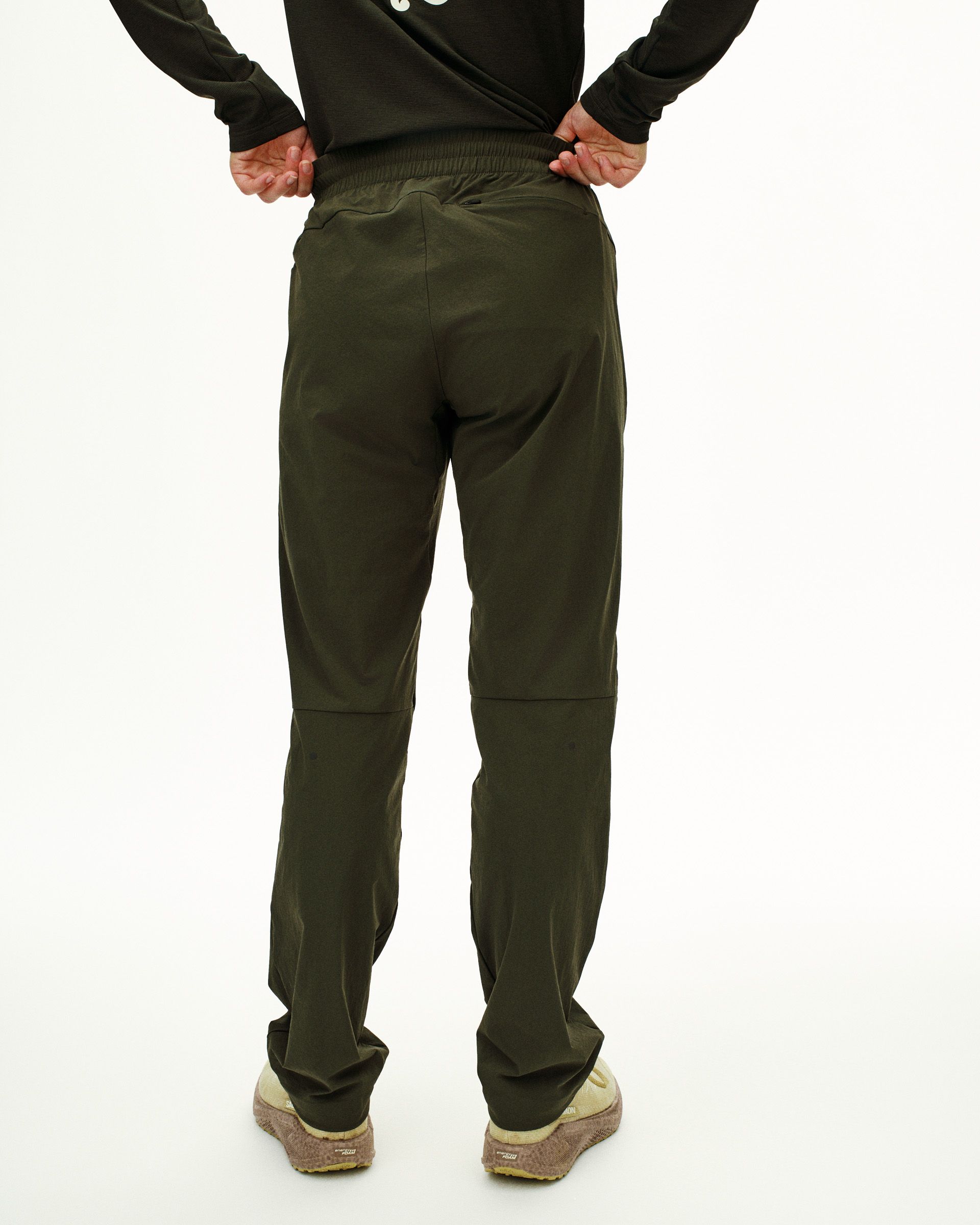 Dark Olive Balance pants, rear view on model with elastic waistband