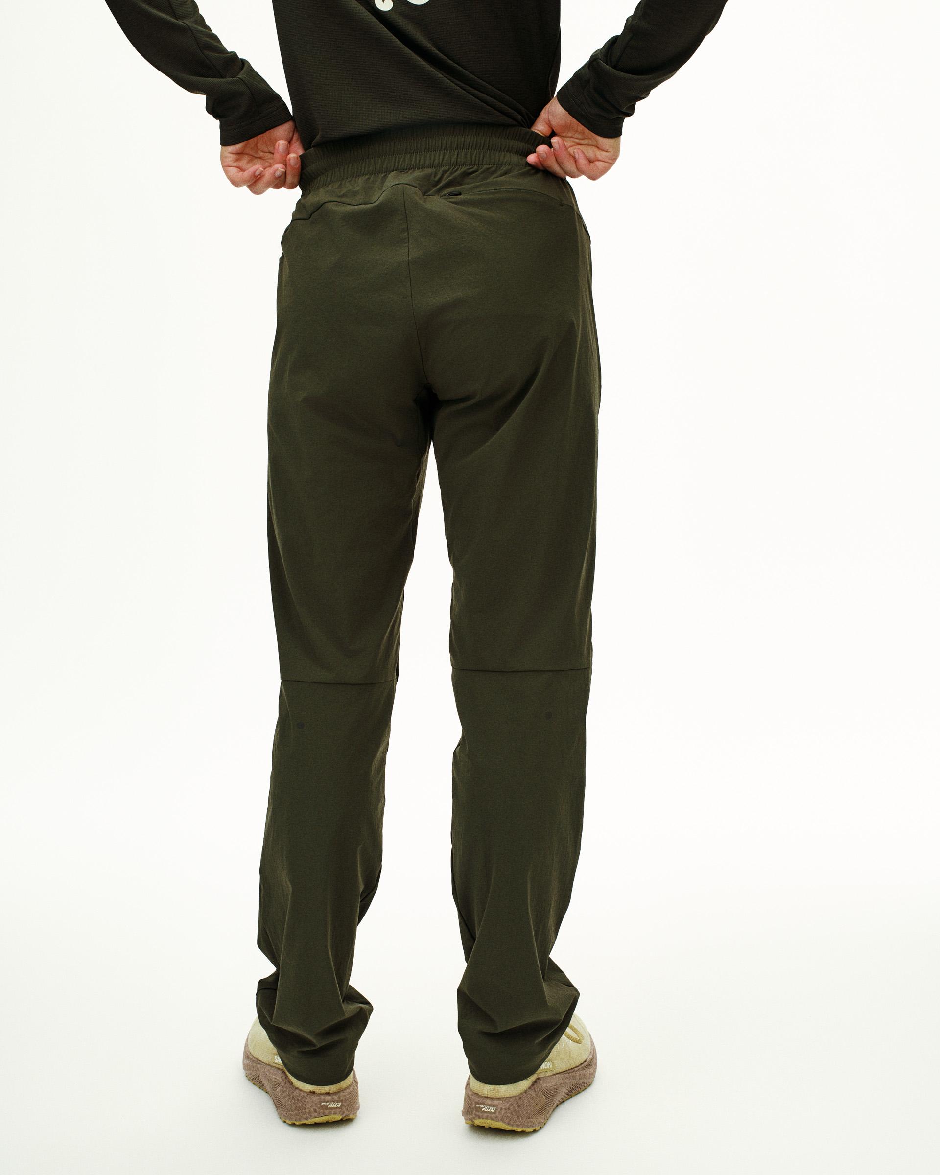 Dark Olive Balance pants, rear view on model with elastic waistband