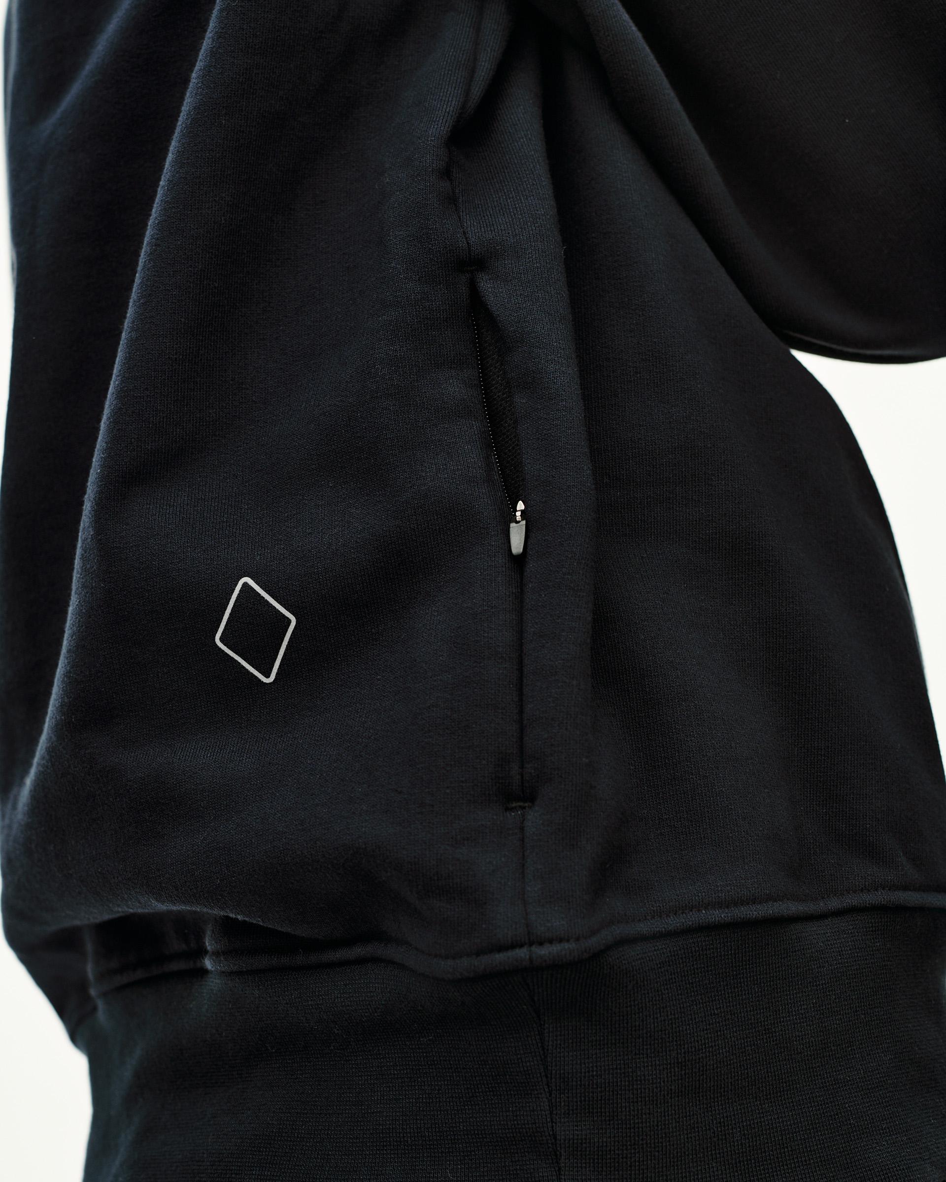 Black Off-Race sweatshirt, detail view of side zip pocket and diamond logo patch