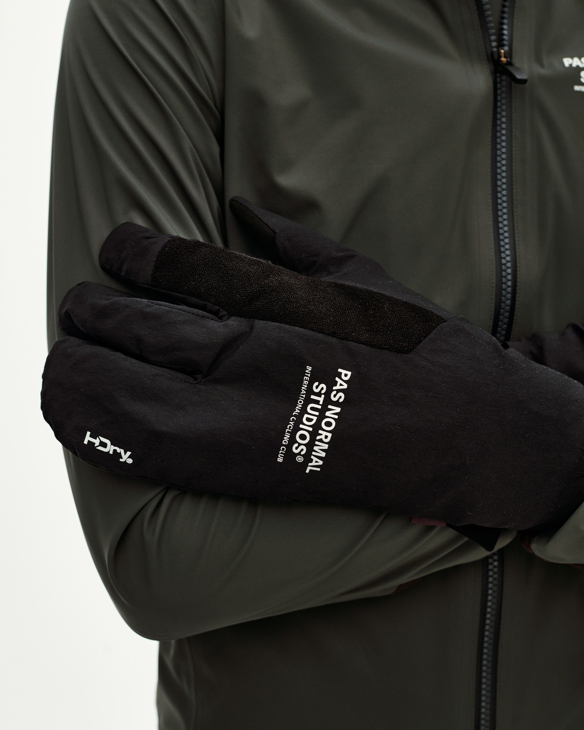 Black Logo Deep Winter Insulated cycling gloves on model, detail view with white branded print on back