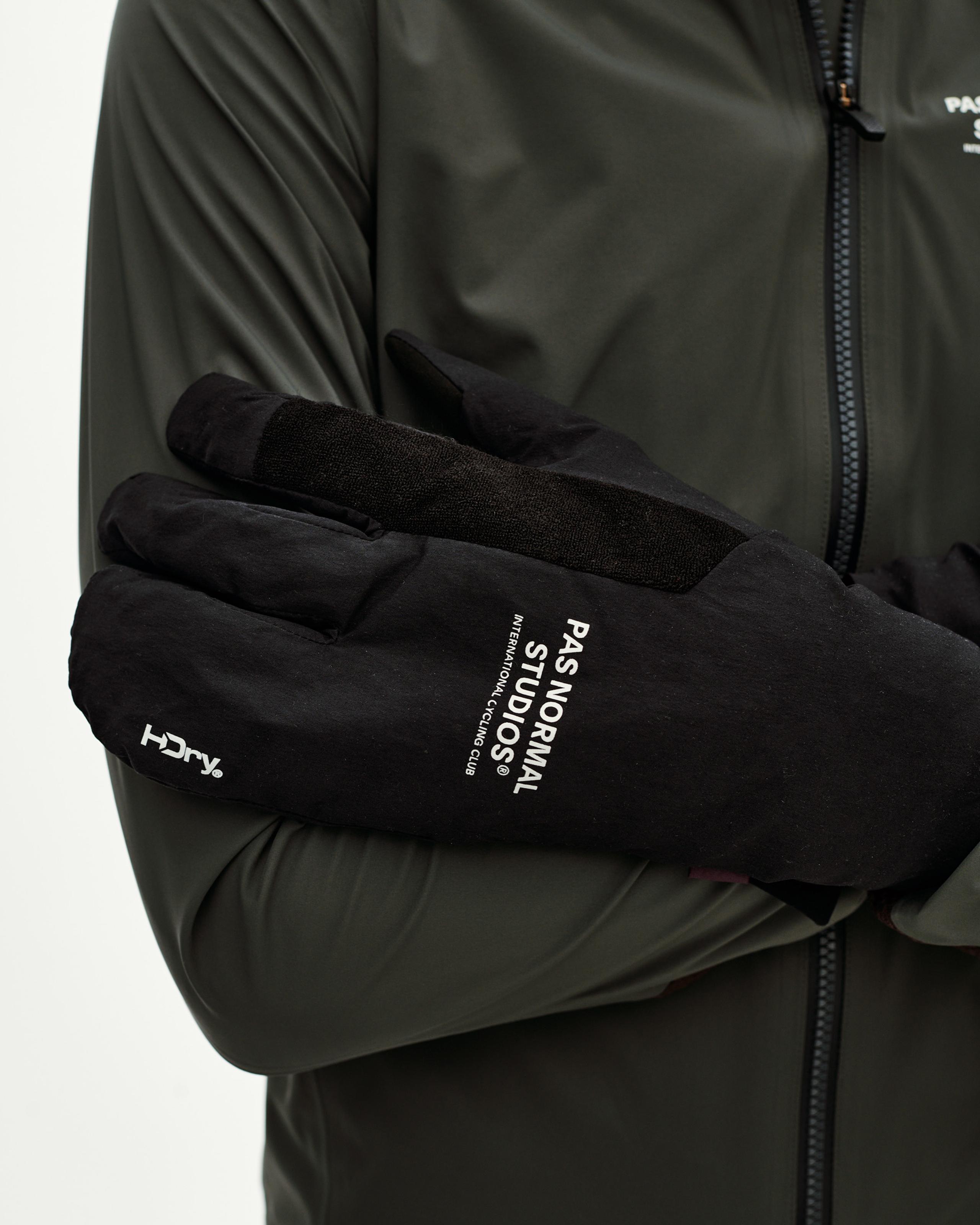 Black Logo Deep Winter Insulated cycling gloves on model, detail view with white branded print on back