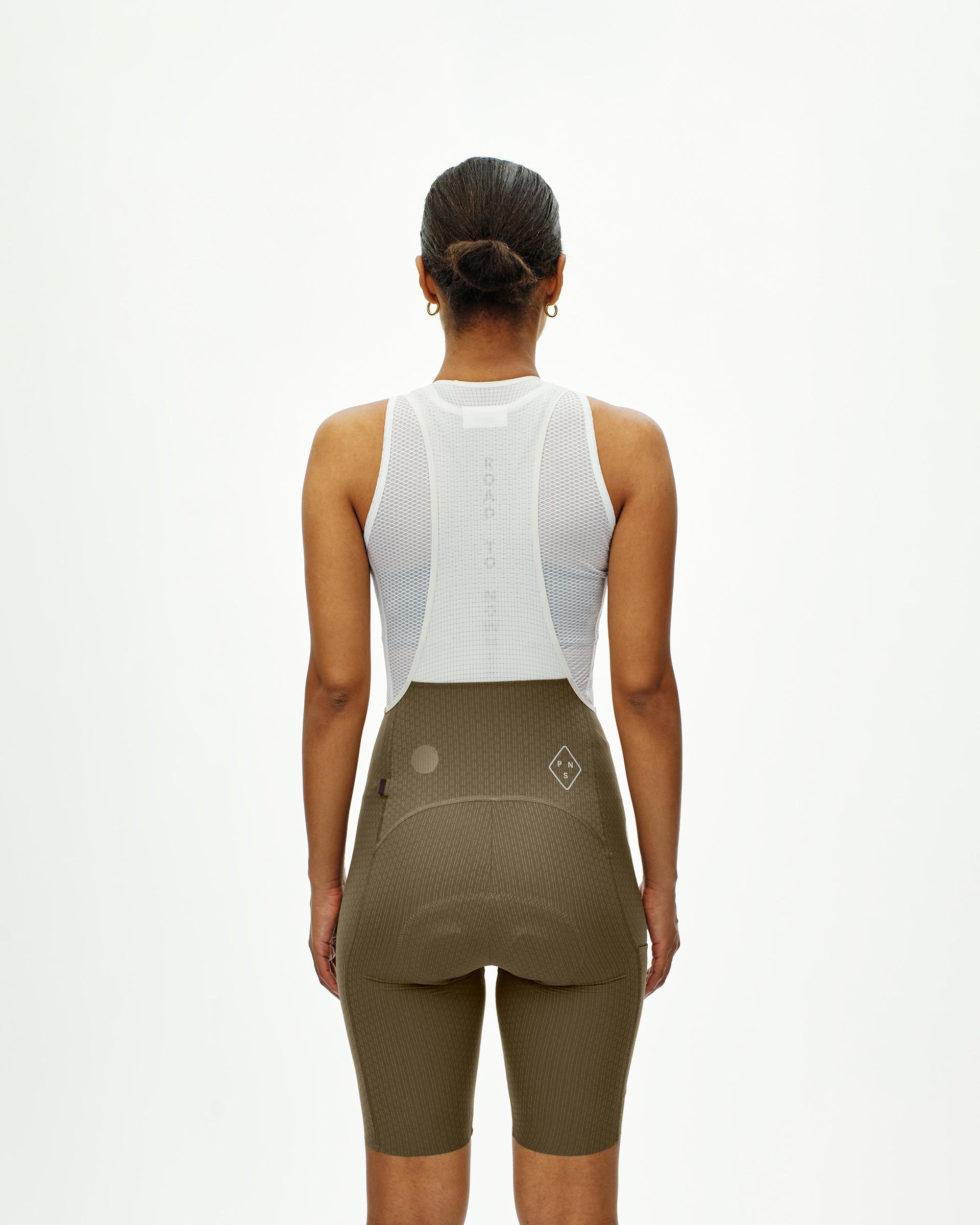 Dark Stone T.K.O. Essential Light Cargo bibs on model, rear view with mesh back panel