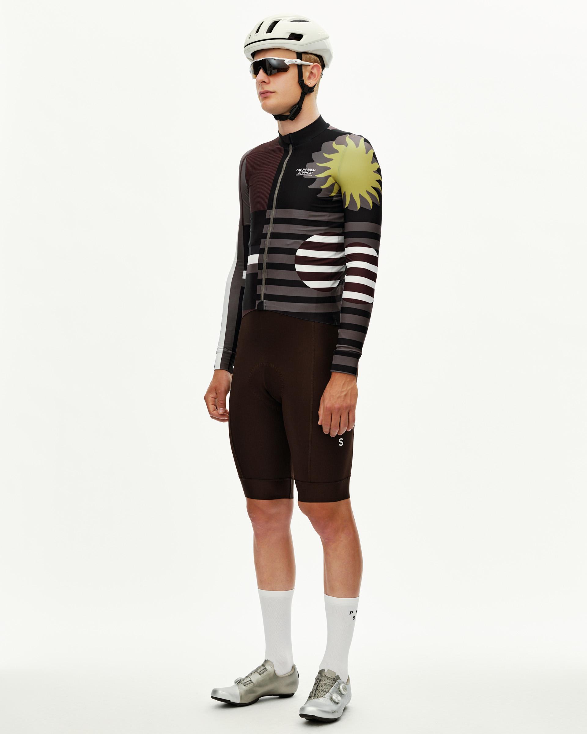 International Dark Olive Mechanism long sleeve cycling jersey, three-quarter front view with sun graphic and stripe print