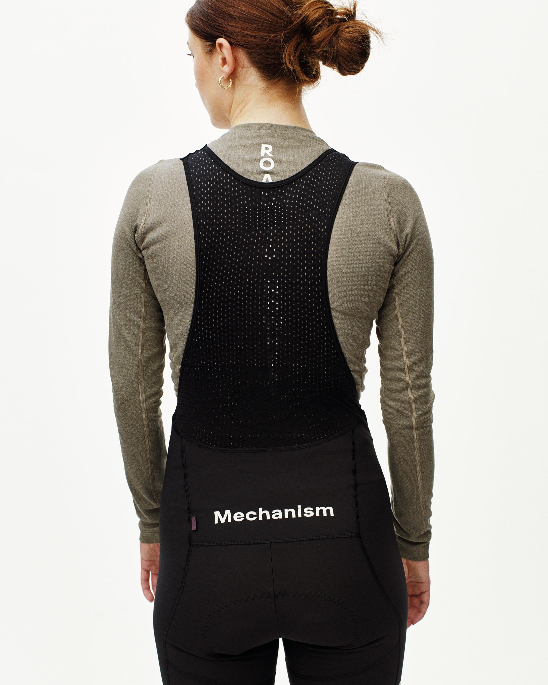 Black Mechanism Deep Winter Long cycling bibs on model, rear view with perforated mesh upper panel