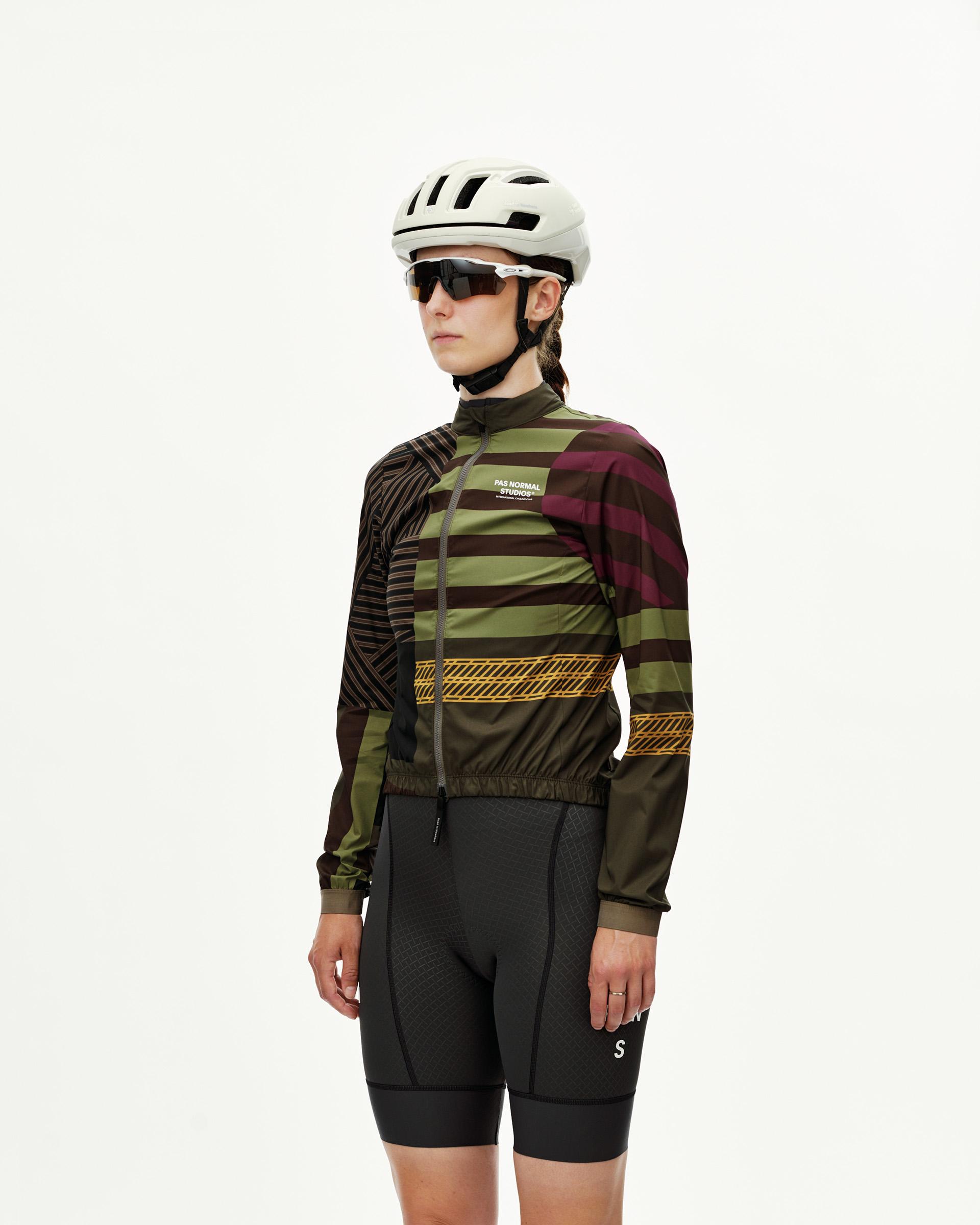 International Green Mechanism Stow Away women's cycling jacket, three-quarter front view with multicolor stripe print