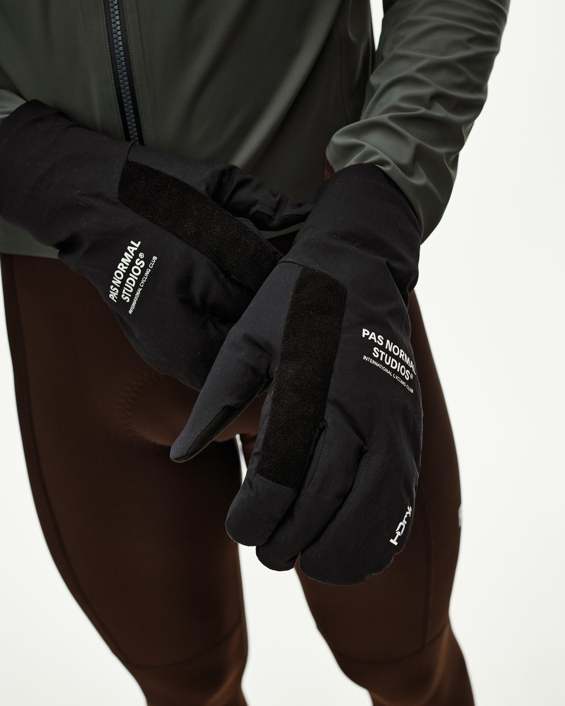 Black Logo Deep Winter Insulated cycling gloves on model, front view with white logo print and textured palm panels