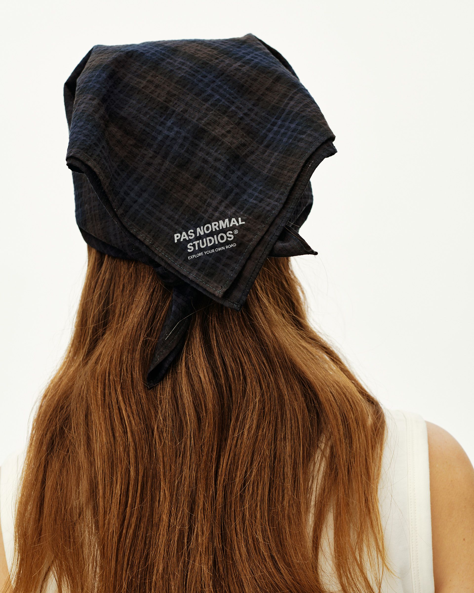 Dark Navy Off-Race Seersucker bandana worn on model, rear view with check texture and tied knot