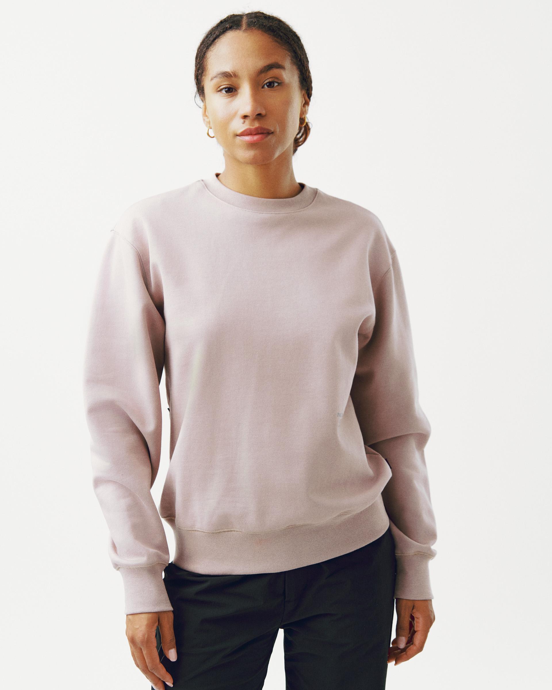 Pink Off-Race sweatshirt on model, front view with ribbed cuffs and hem
