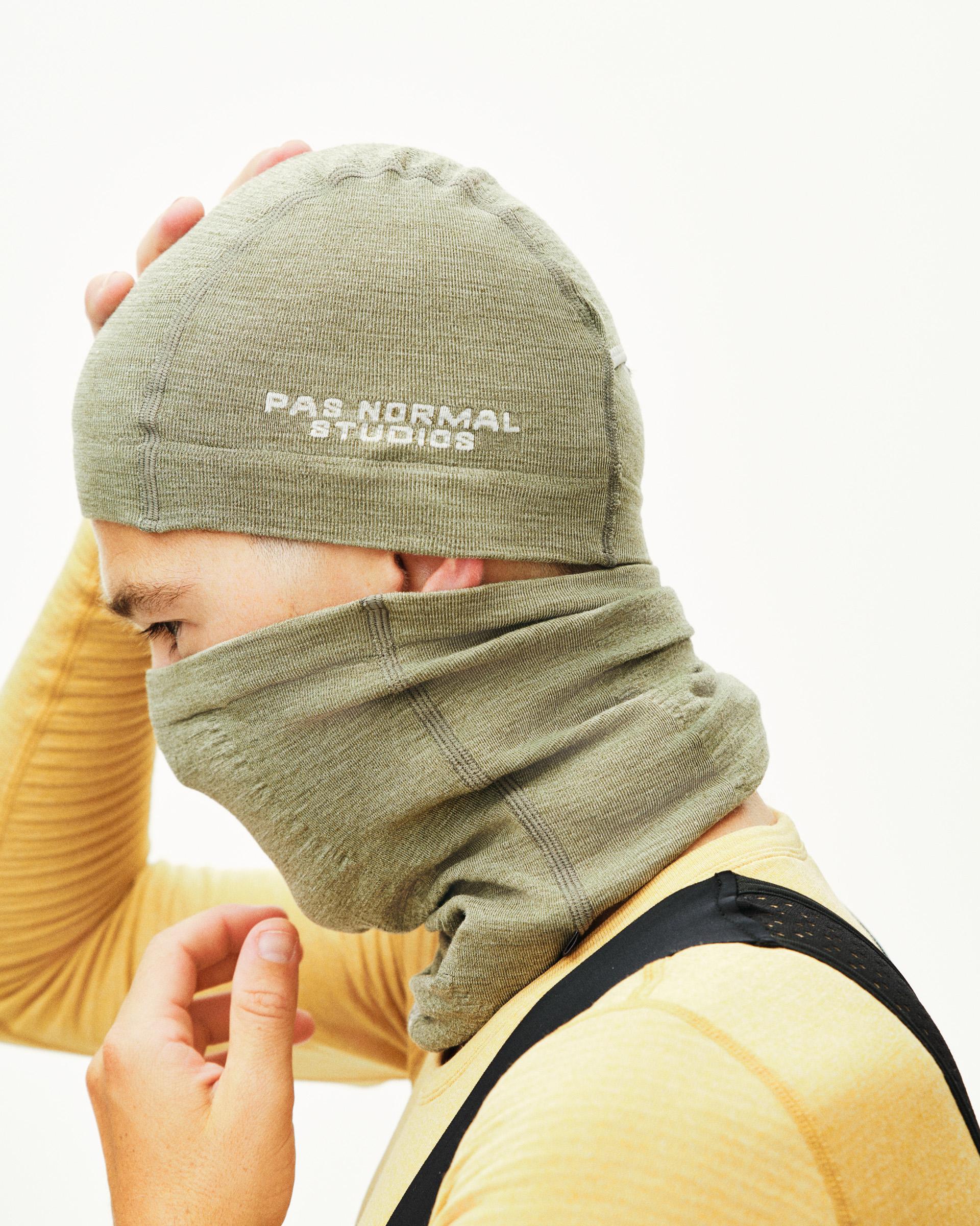 Green Logo Merino Knit beanie on model with white text and folded cuff