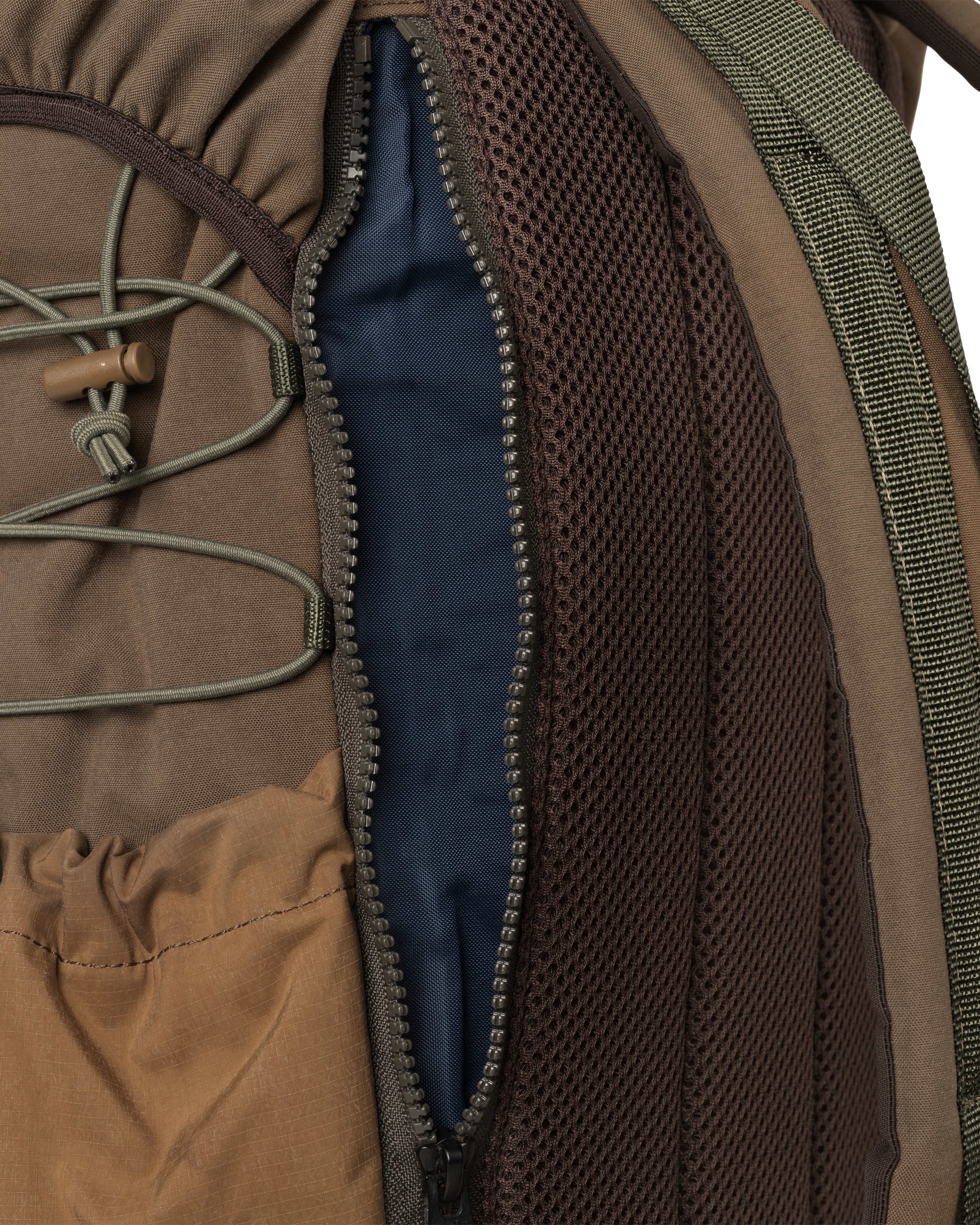 Light Brown Porter-Yoshida backpack, detail view of opened main compartment with blue liner and mesh panel