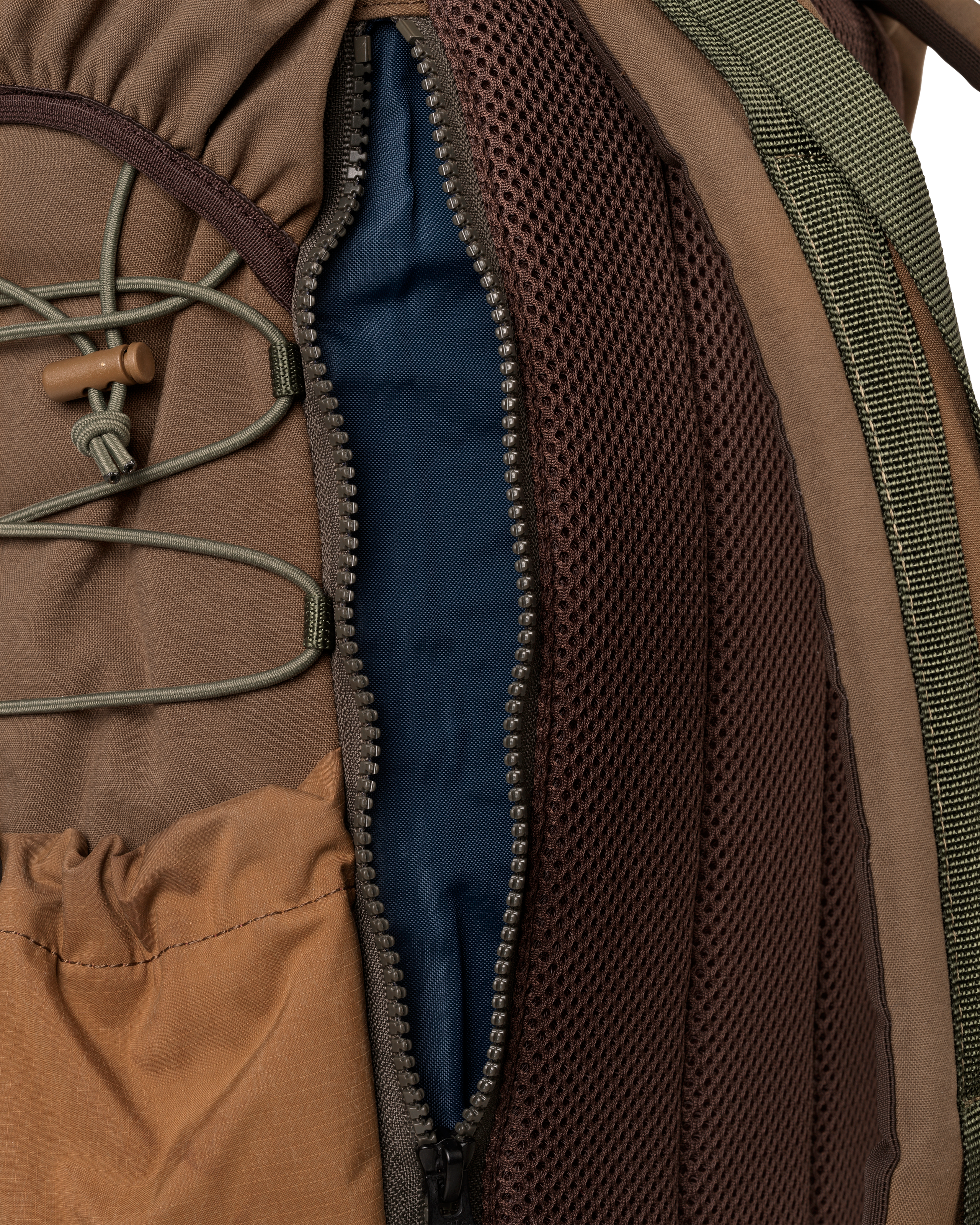 Light Brown Porter-Yoshida backpack, detail view of opened main compartment with blue liner and mesh panel